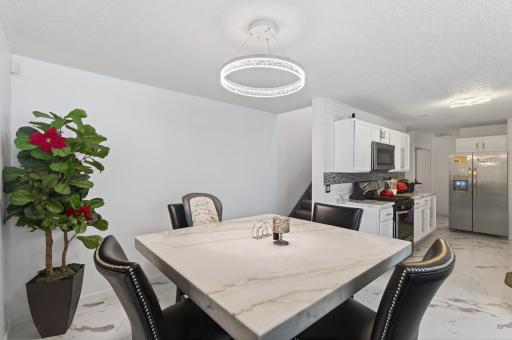 Open to the kitchen for effortless meals and everyday convenience.