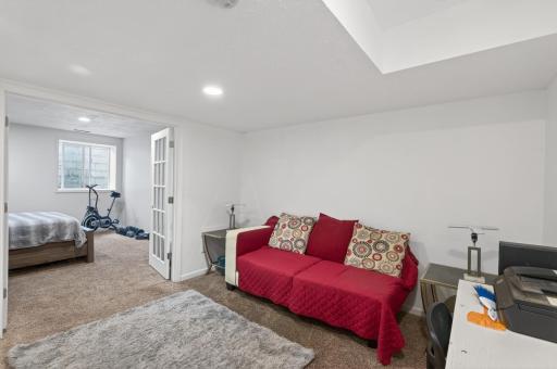 Downstairs, the lower level offers a comfortable recreation room.