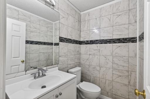 Main level 1/2 bath just off the kitchen and laundry room.