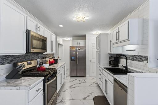 Stainless steel appliances create a clean, cohesive look that is easy to maintain.