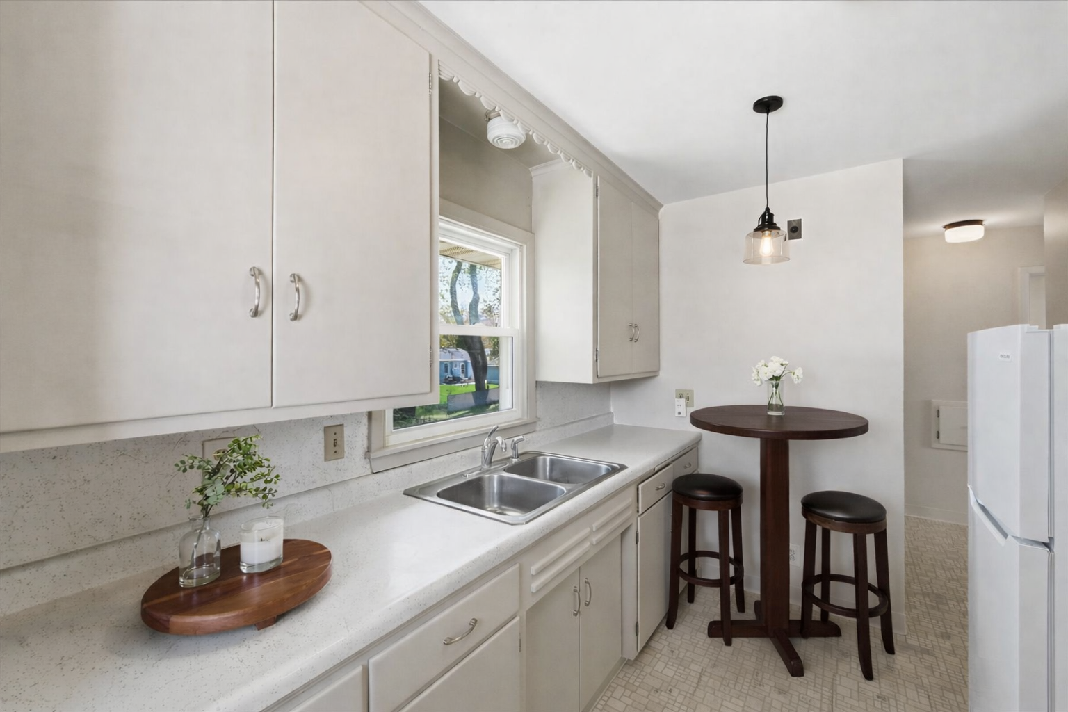 The light and table are digitally imposed. Freshly updated kitchen.