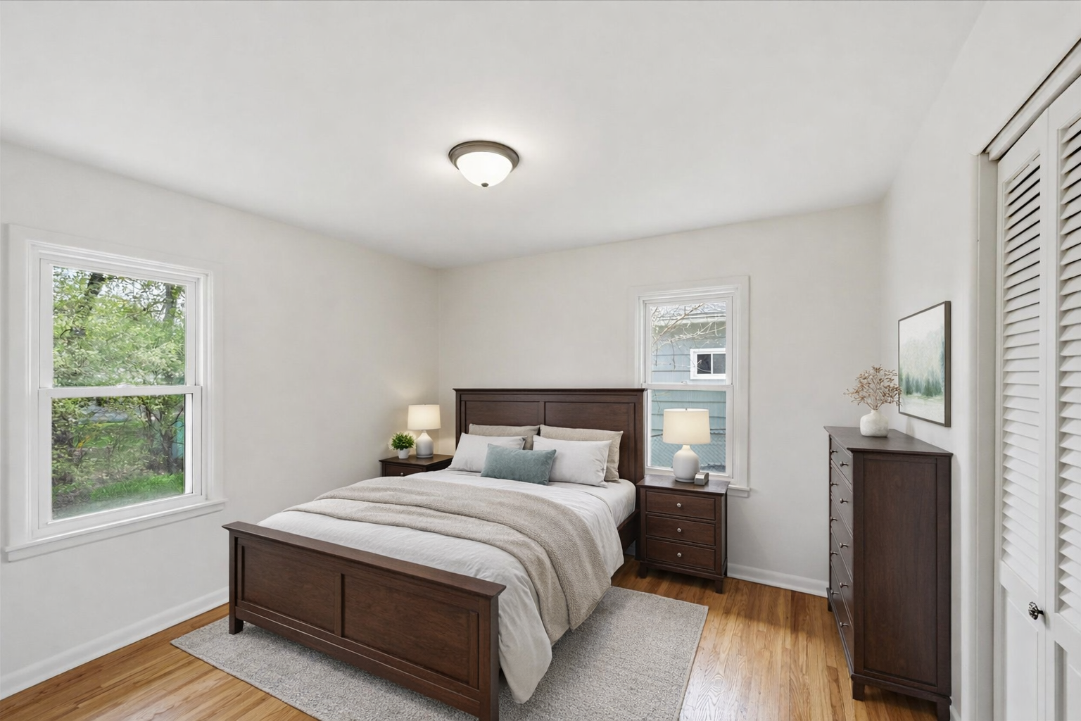 Digitally enhanced primary bedroom.