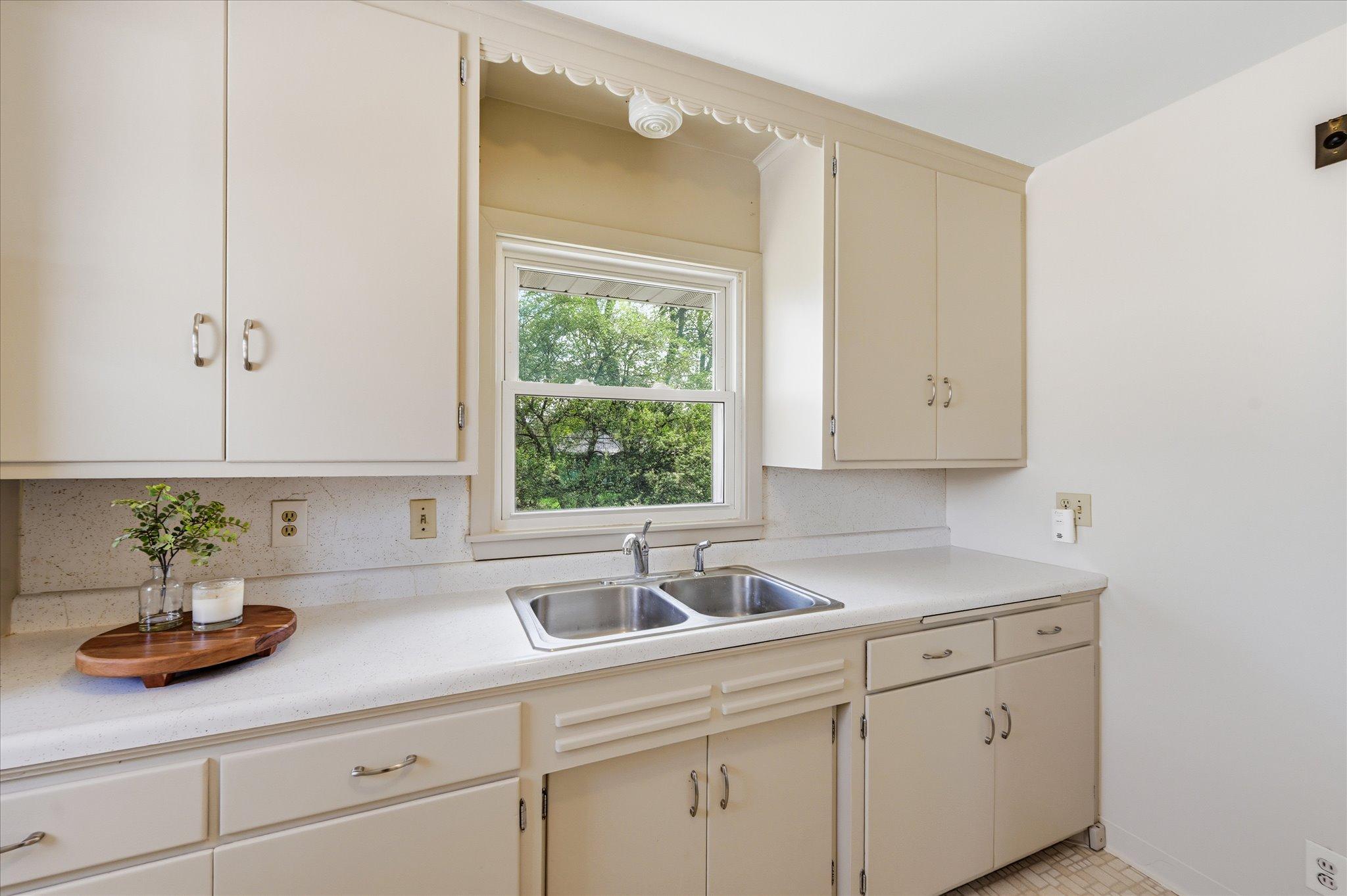 Hang out at your kitchen sink and enjoy the views of your private backyard oasis.