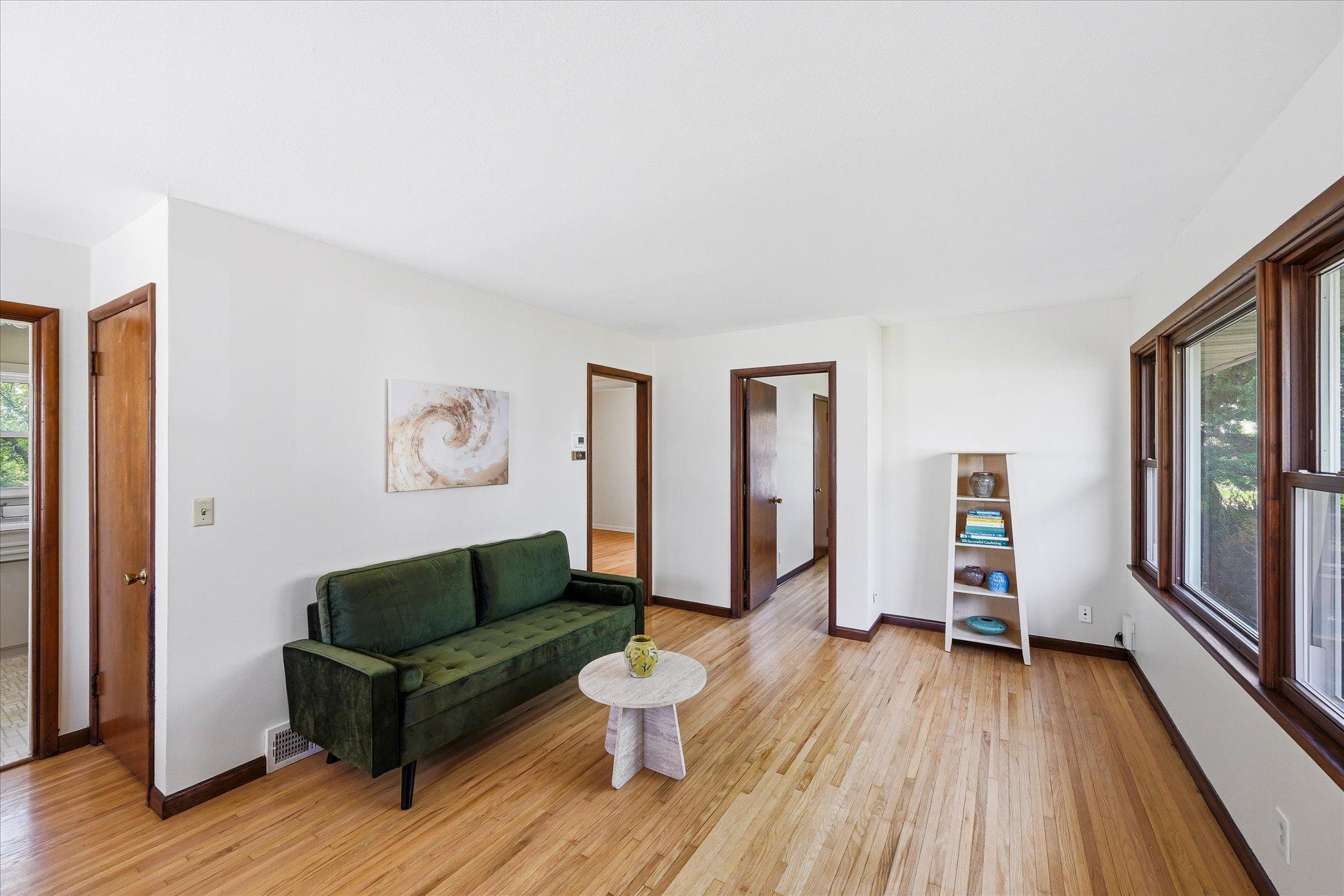 Living room flows to two main floor bedrooms.