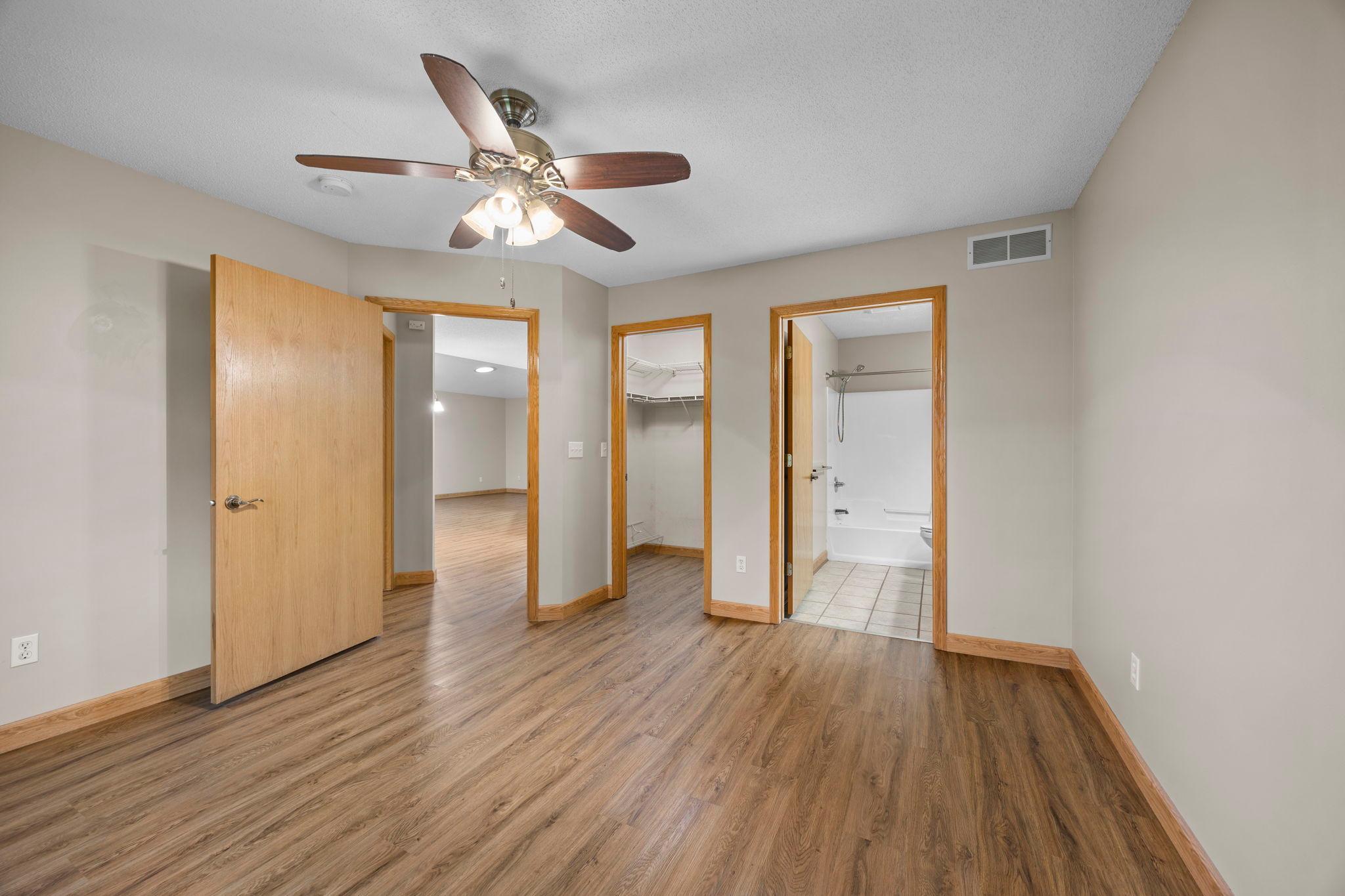 The primary suite has a walk-in closet and private bathroom.