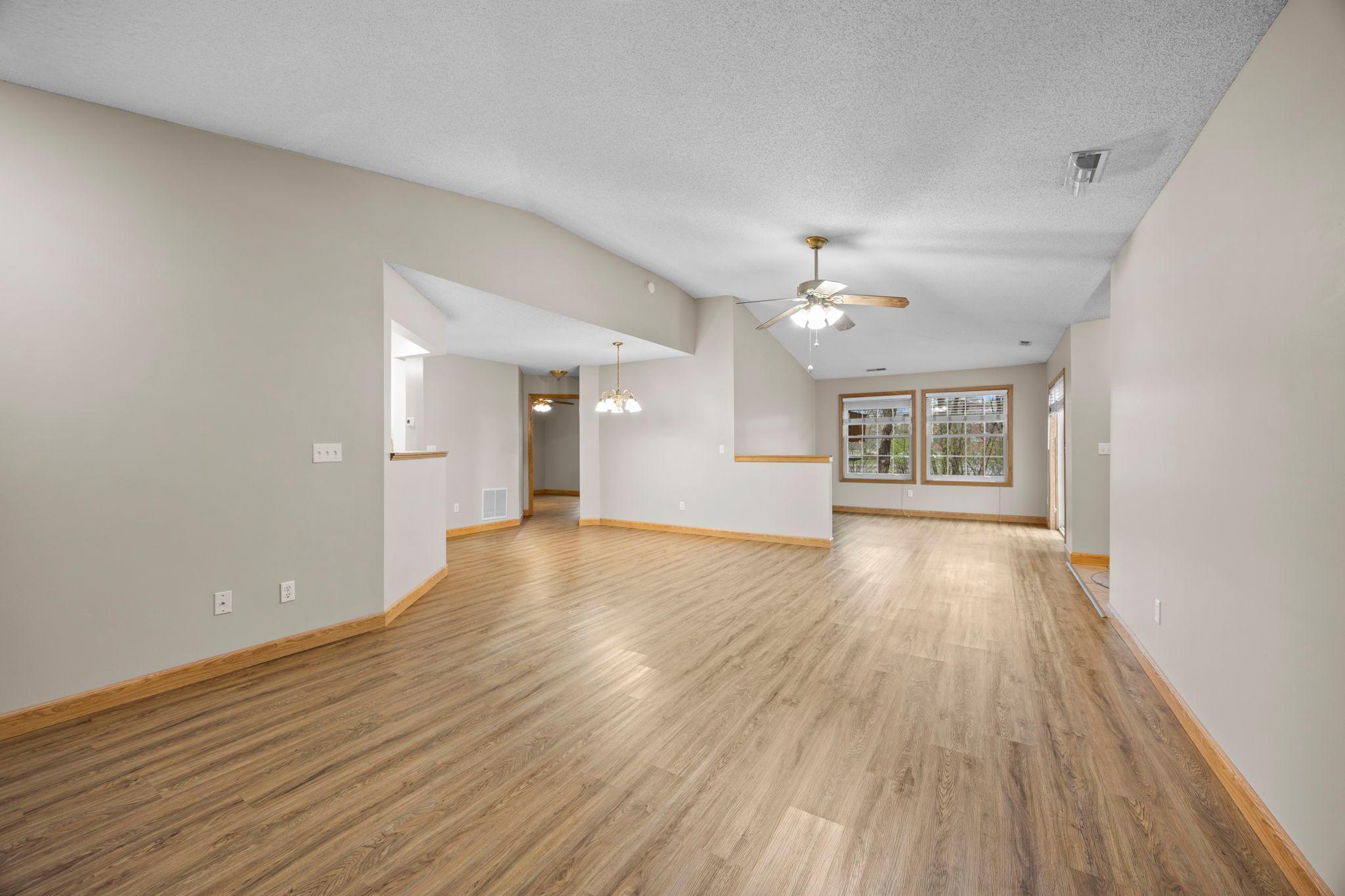 Look at all this space! Living room towards sunroom and dining area.