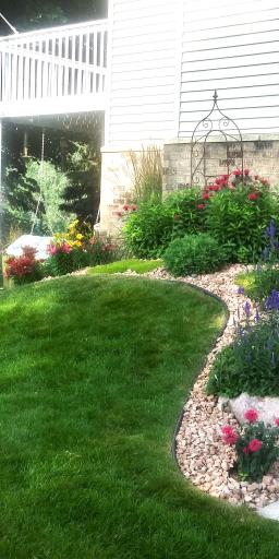 Hand-selected plantings and floral arrangements give the exterior a lush, curated charm that blooms with personality.