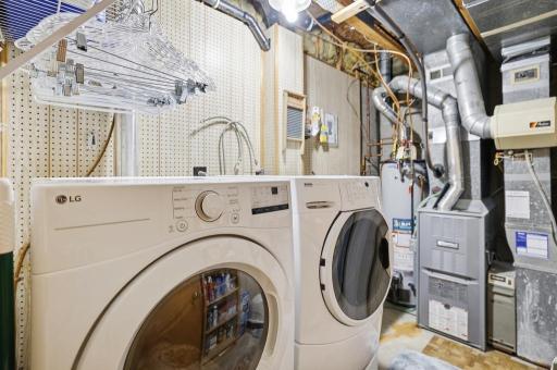 Laundry day just got a little easier â LG front-load dryer and Kenmore Elite front-load washer on pedestal, all in a dedicated lower level laundry room.