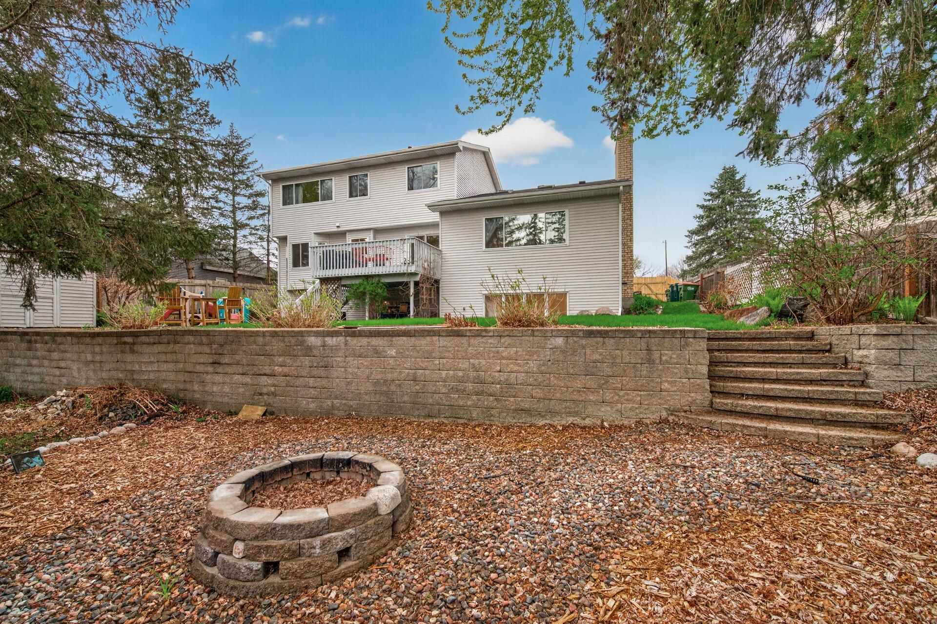 Mature trees and thoughtful landscaping provide a backyard oasis!