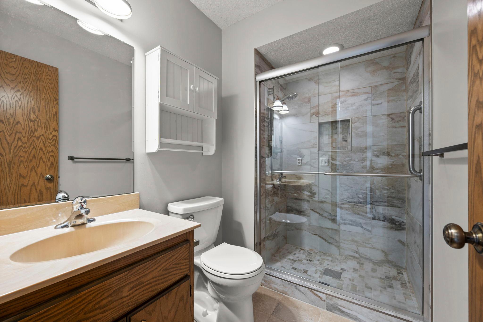 The third level 3/4 bath has been updated with new a shower