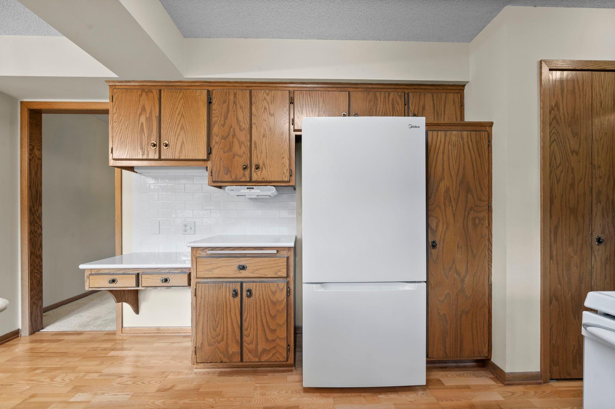Additional storage space in the kitchen with build in desk space