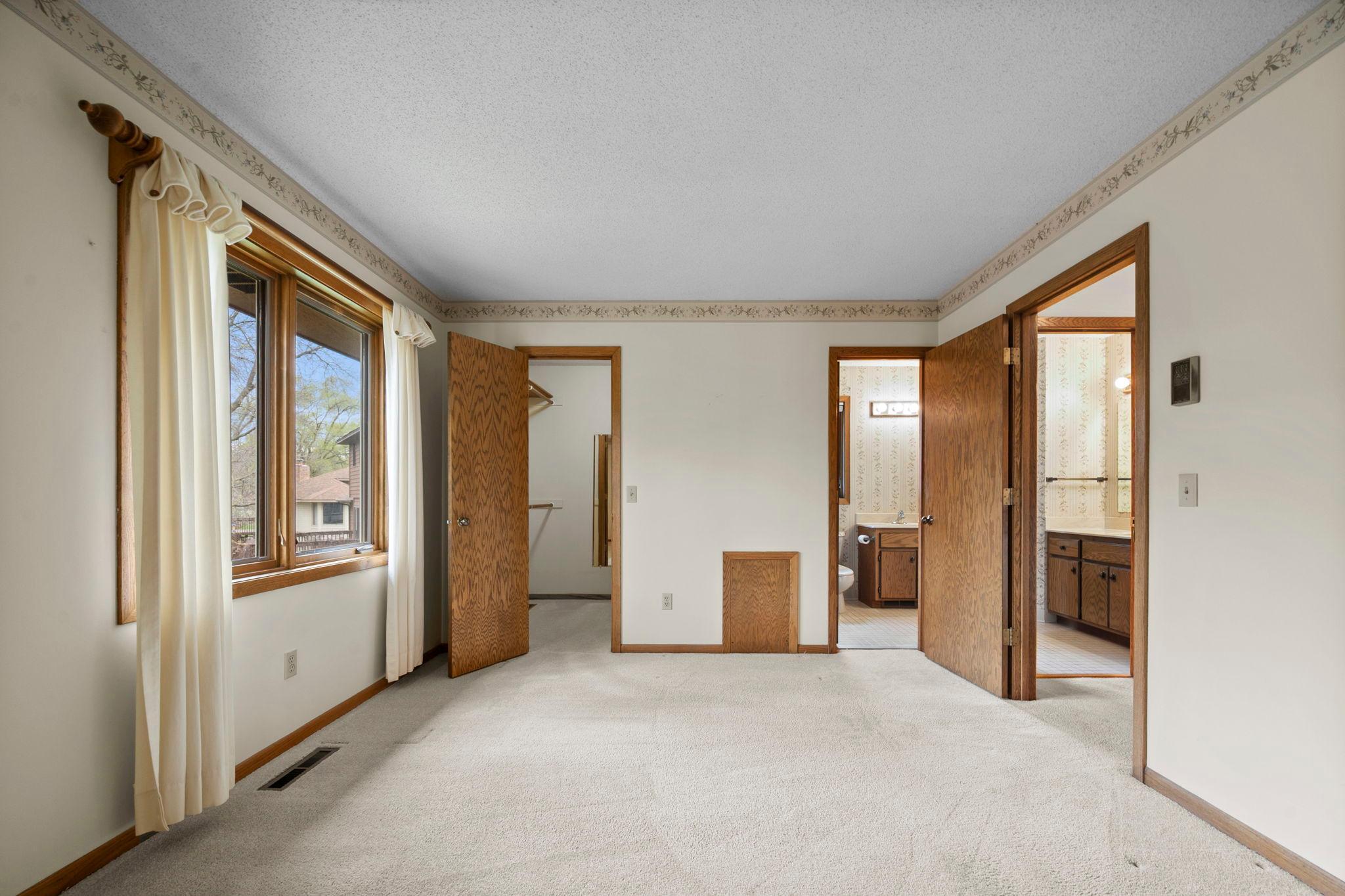 The primary bedroom has a large walk in closet and walk-through access to the full bathroom