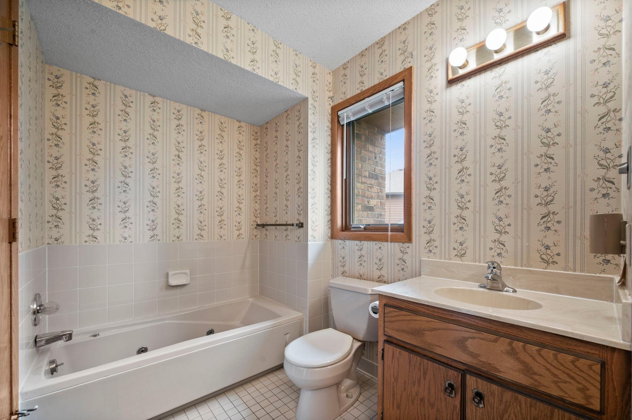 Walk-through full bath has a jetted tub