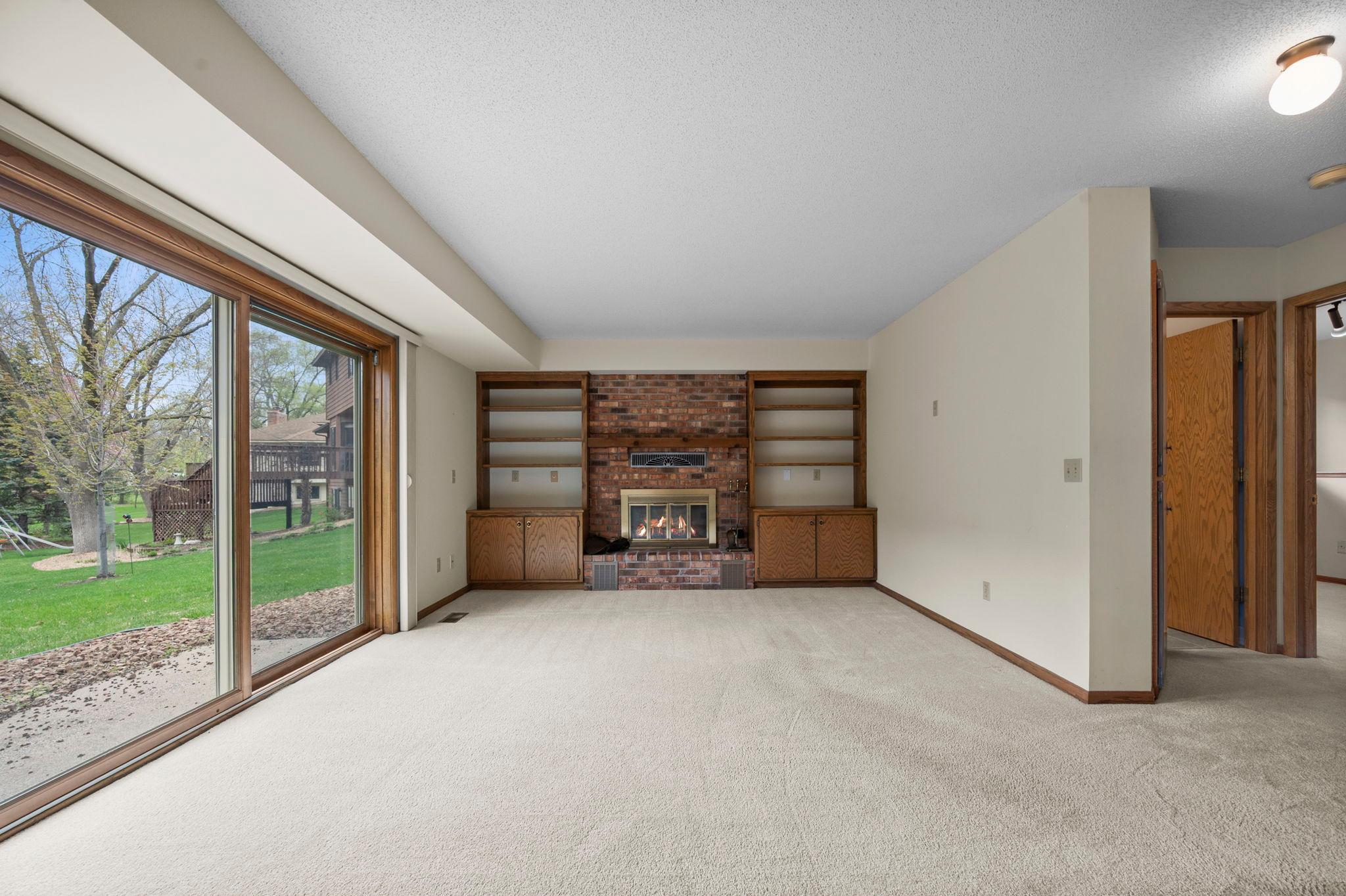 Built ins and fireplace completes the space in the family room