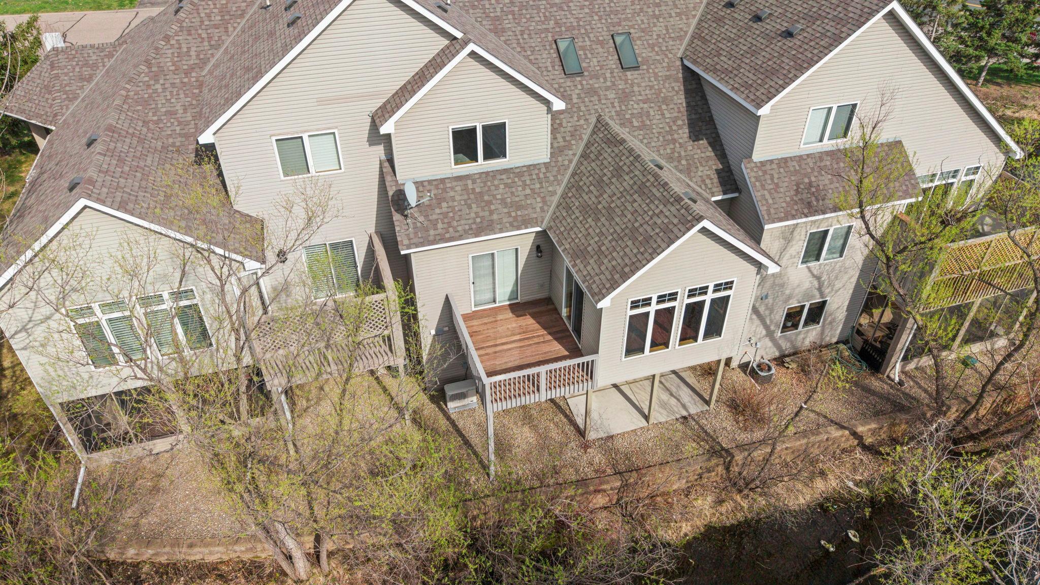 New deck boards just completed on this unit! Private, backyard setting with serene pond views!