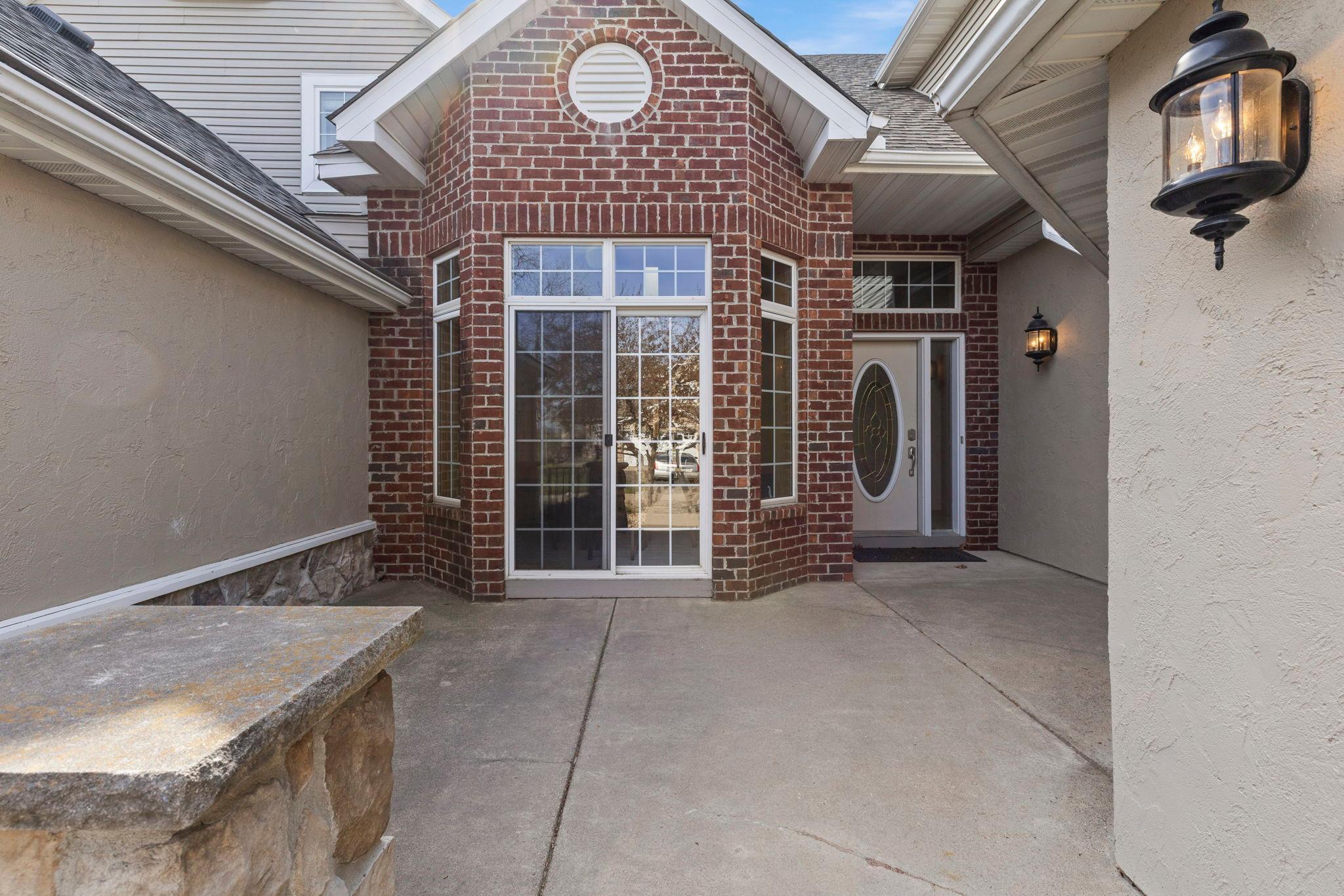 Designed to impressed. Brick, large windows and front walkout from kitchen to patio retreat.