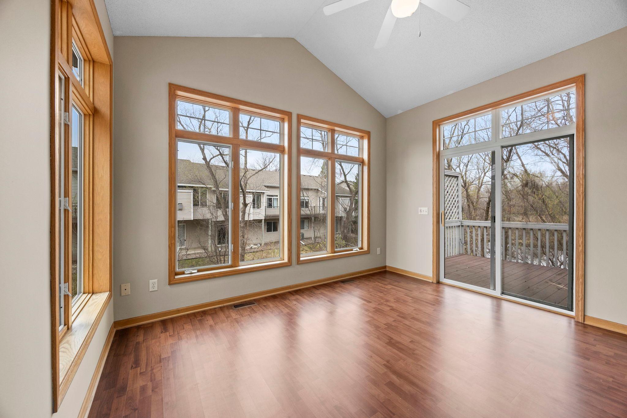 Vaulted ceilings, large windows. Easy access to deck from sunroom and primary bedroom.