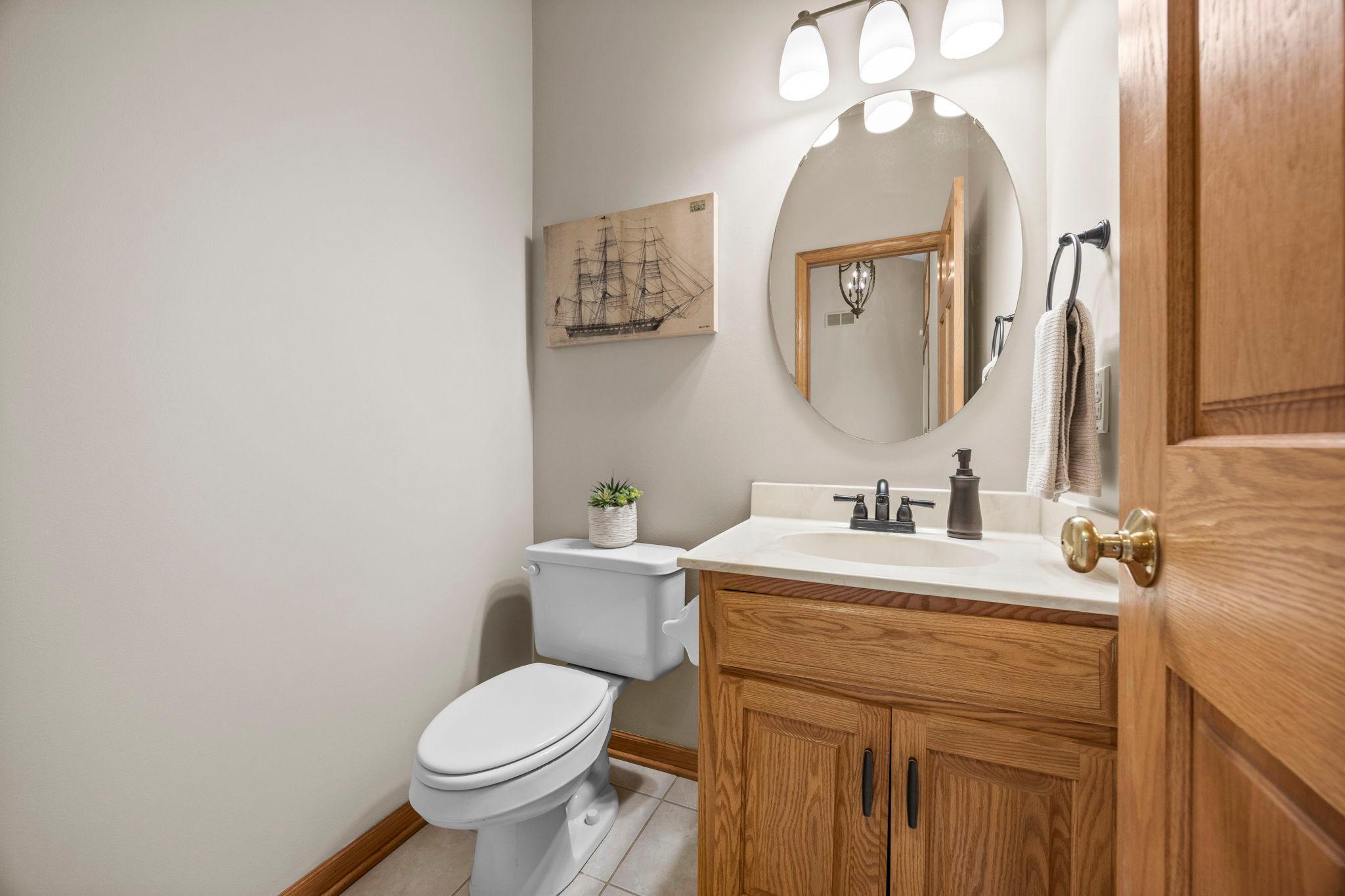 Main level 1/2 bathroom located just off foyer and kitchen.