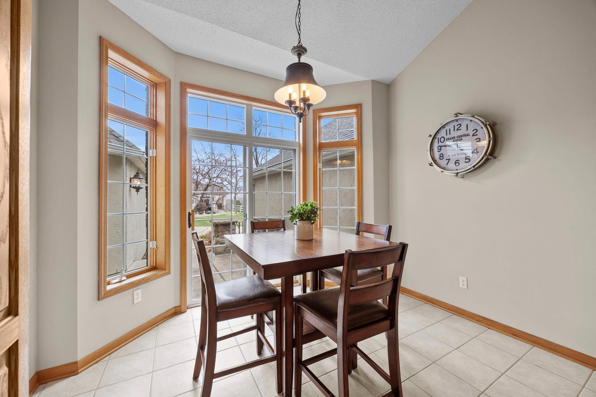 Informal dining walks out to private patio.