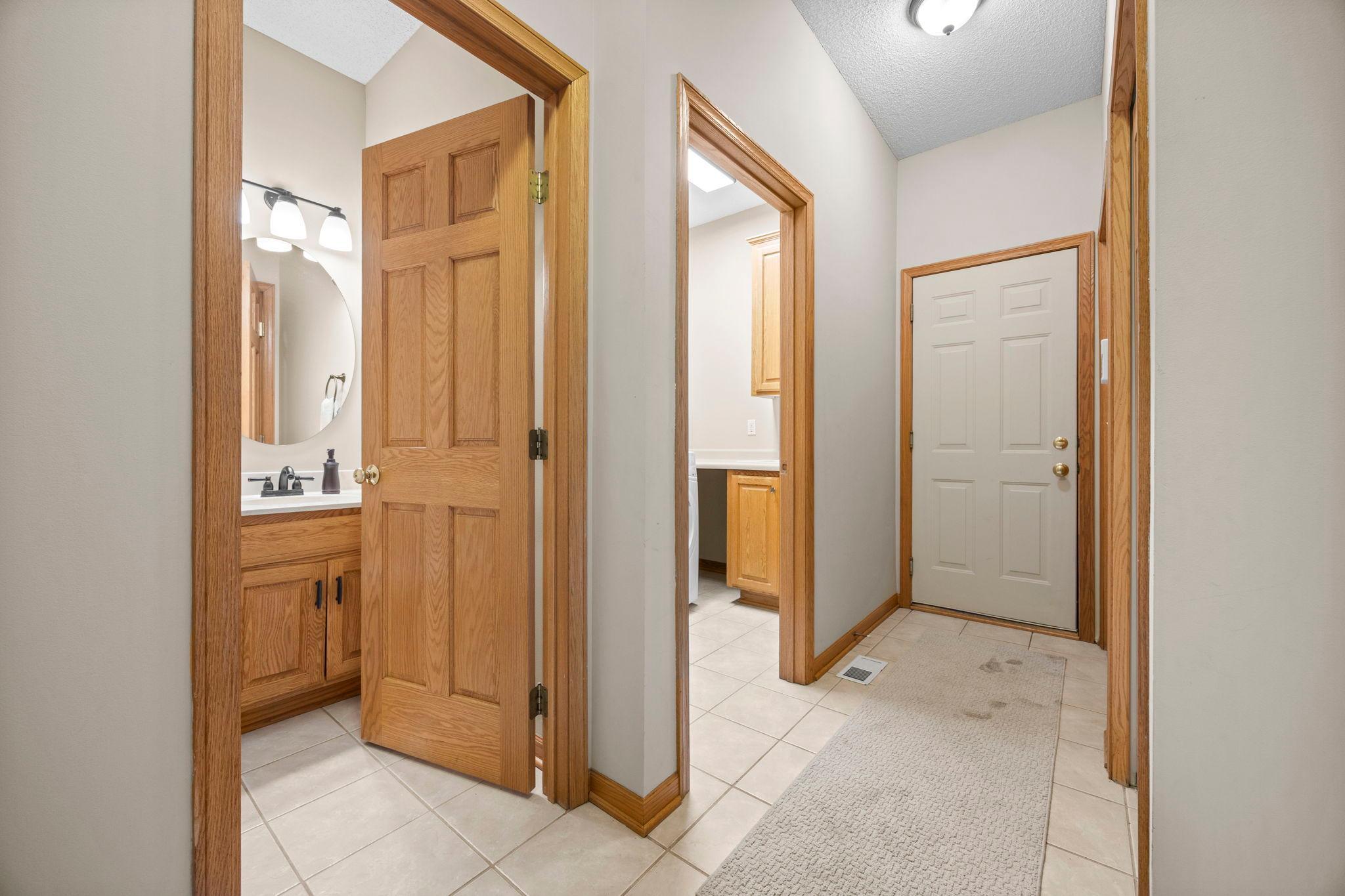 Convenient Main level 1/2 bathroom and main level laundry.