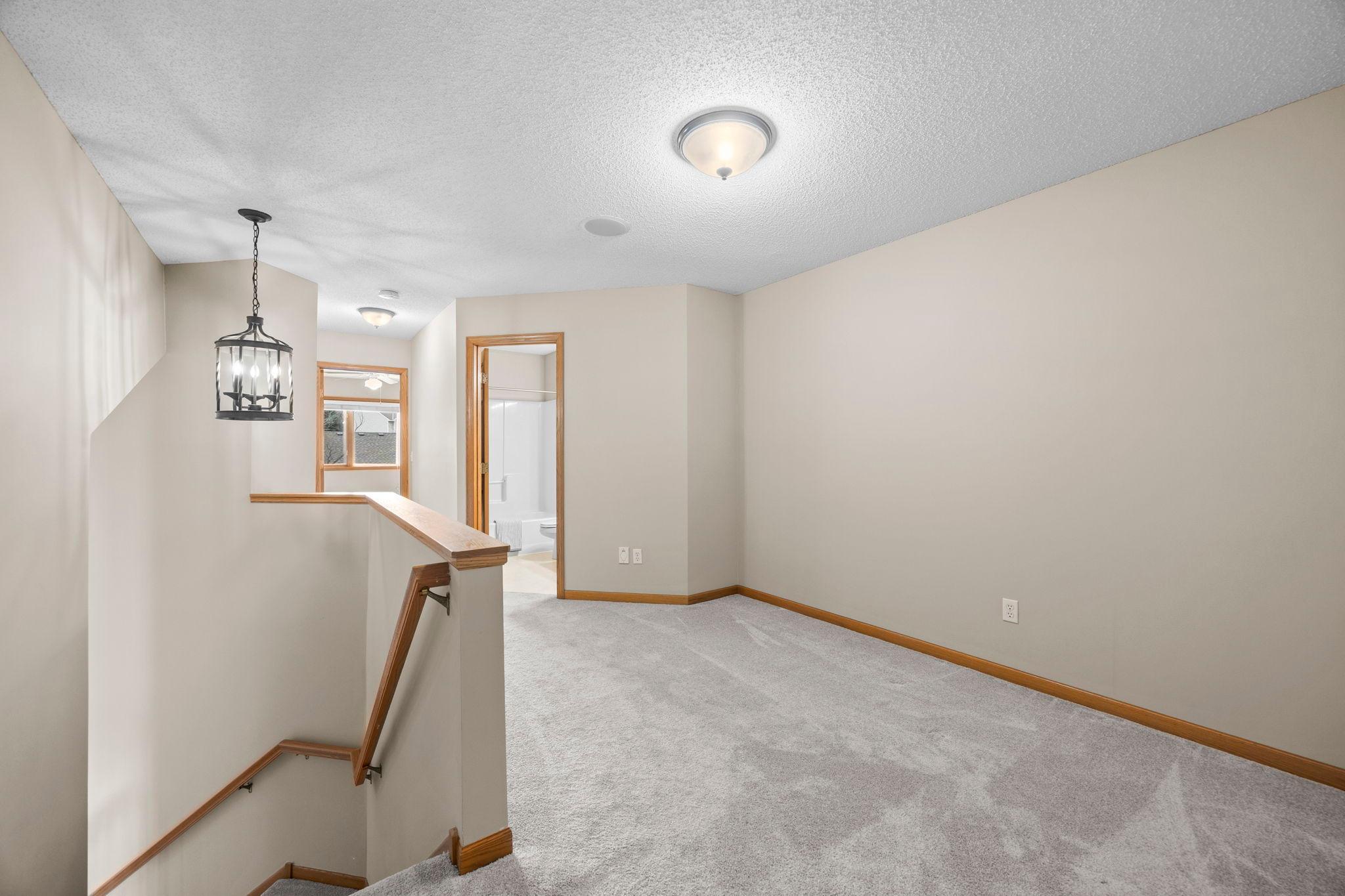 Two spacious bedrooms and loft on the upper level.