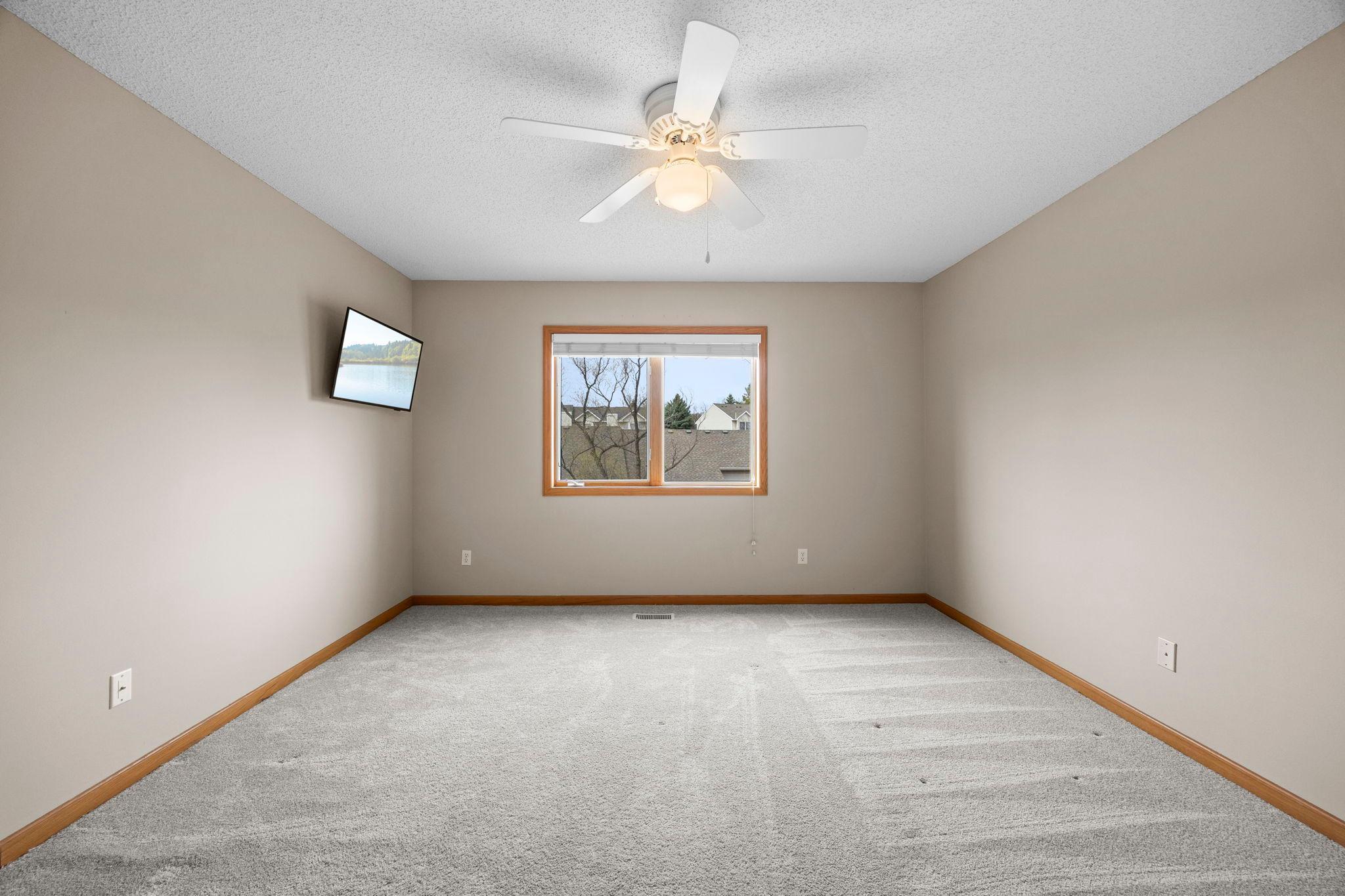Spacious upper bedrooms with neutral carpeting and paint.