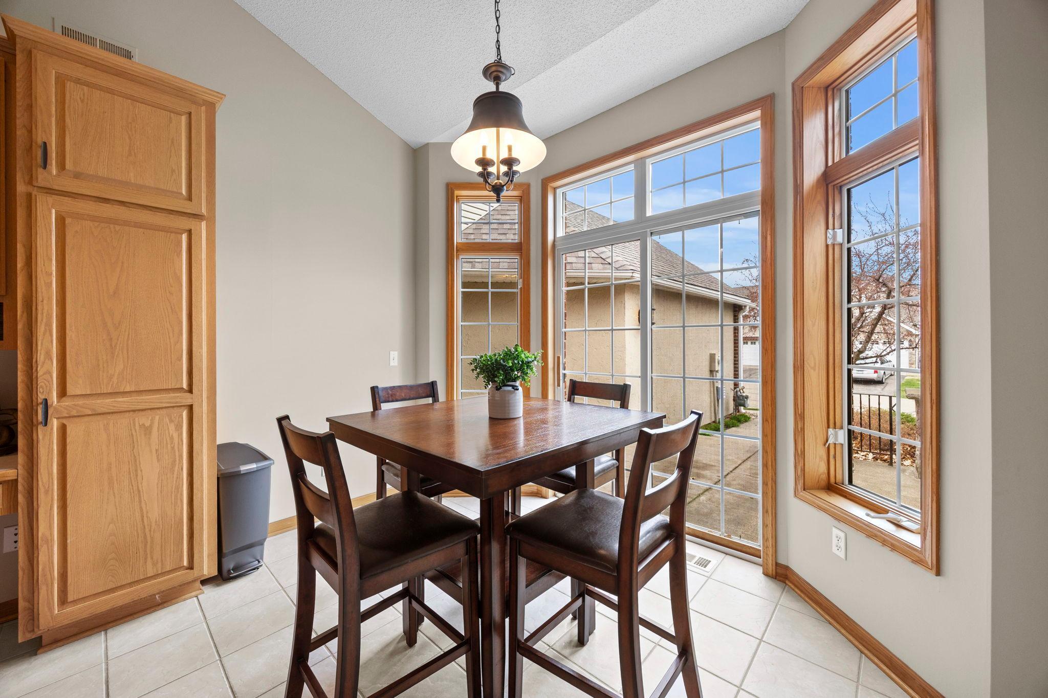 Informal dining walks out to private patio.