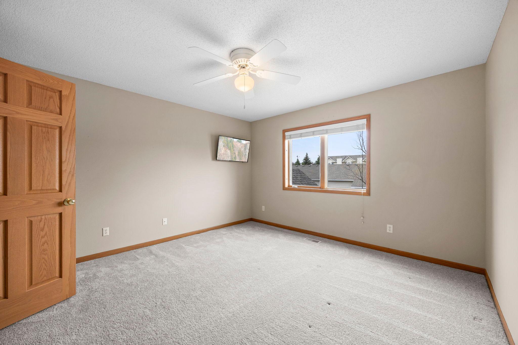 Spacious upper bedrooms with neutral carpeting and paint.