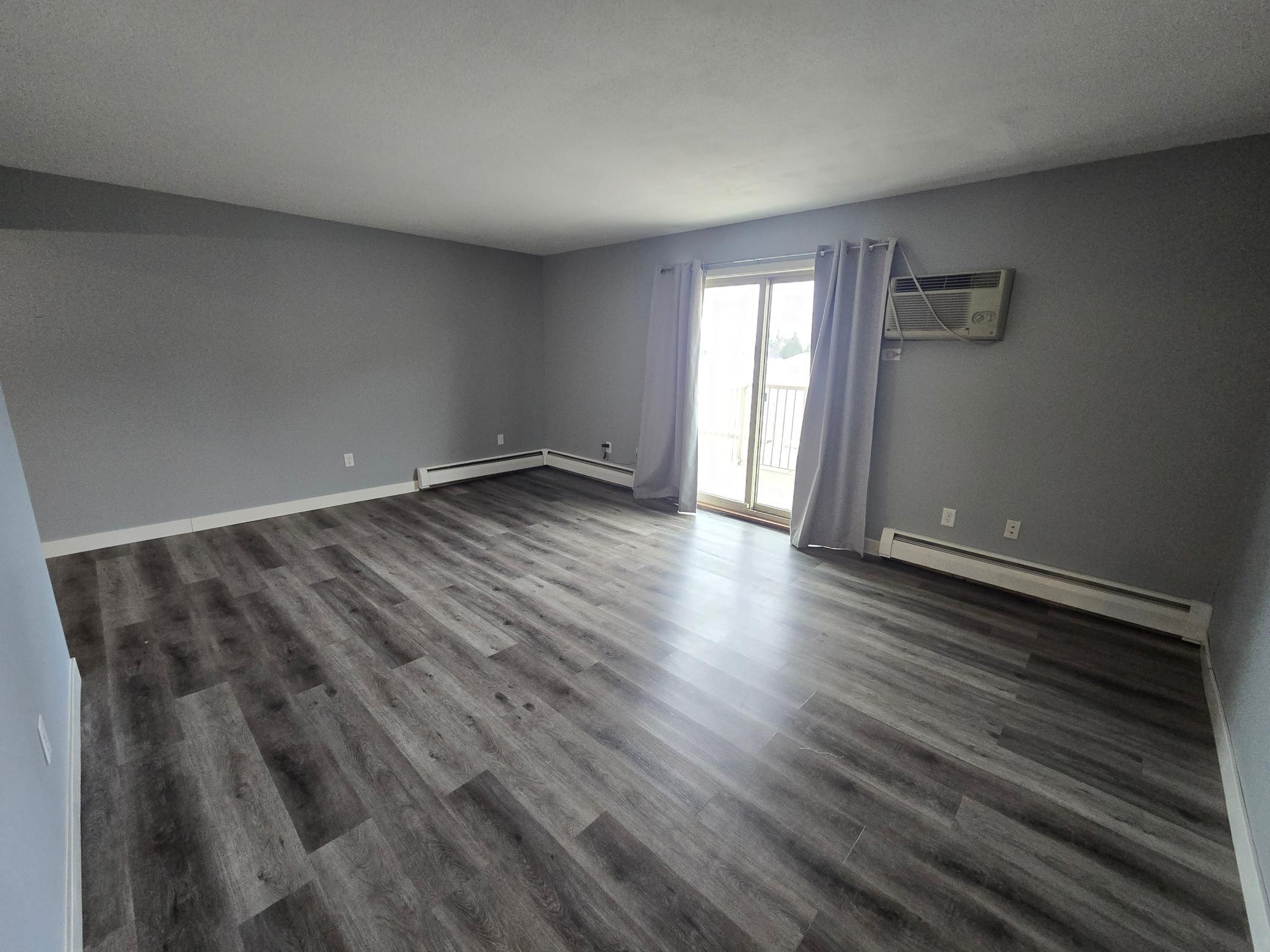 Living room with sliding door out to patio