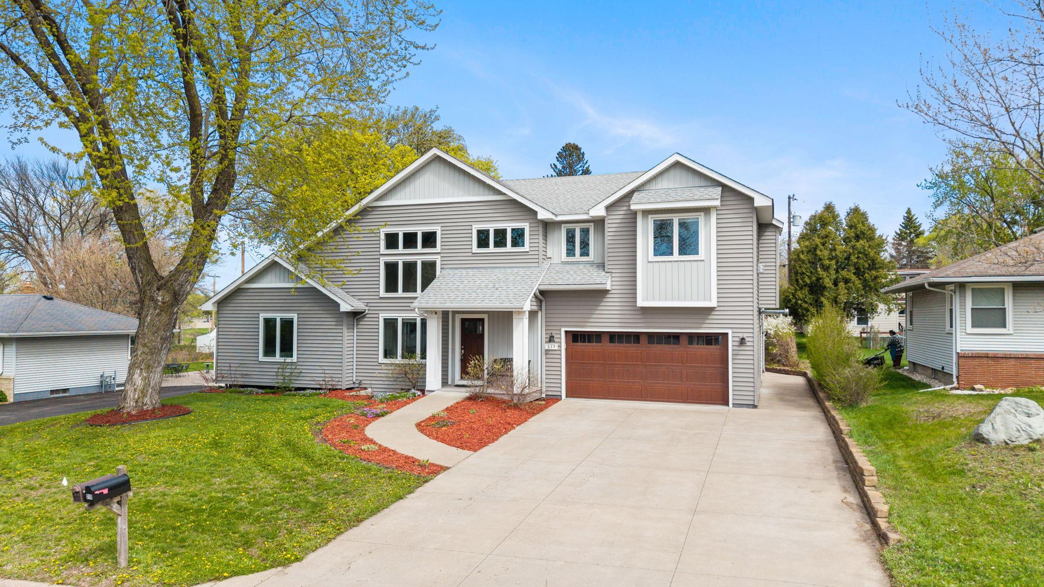 Spacious 5-bedroom, 4-bathroom home in Maplewood that offers exceptional curb appeal and a versatile, well-designed layout!