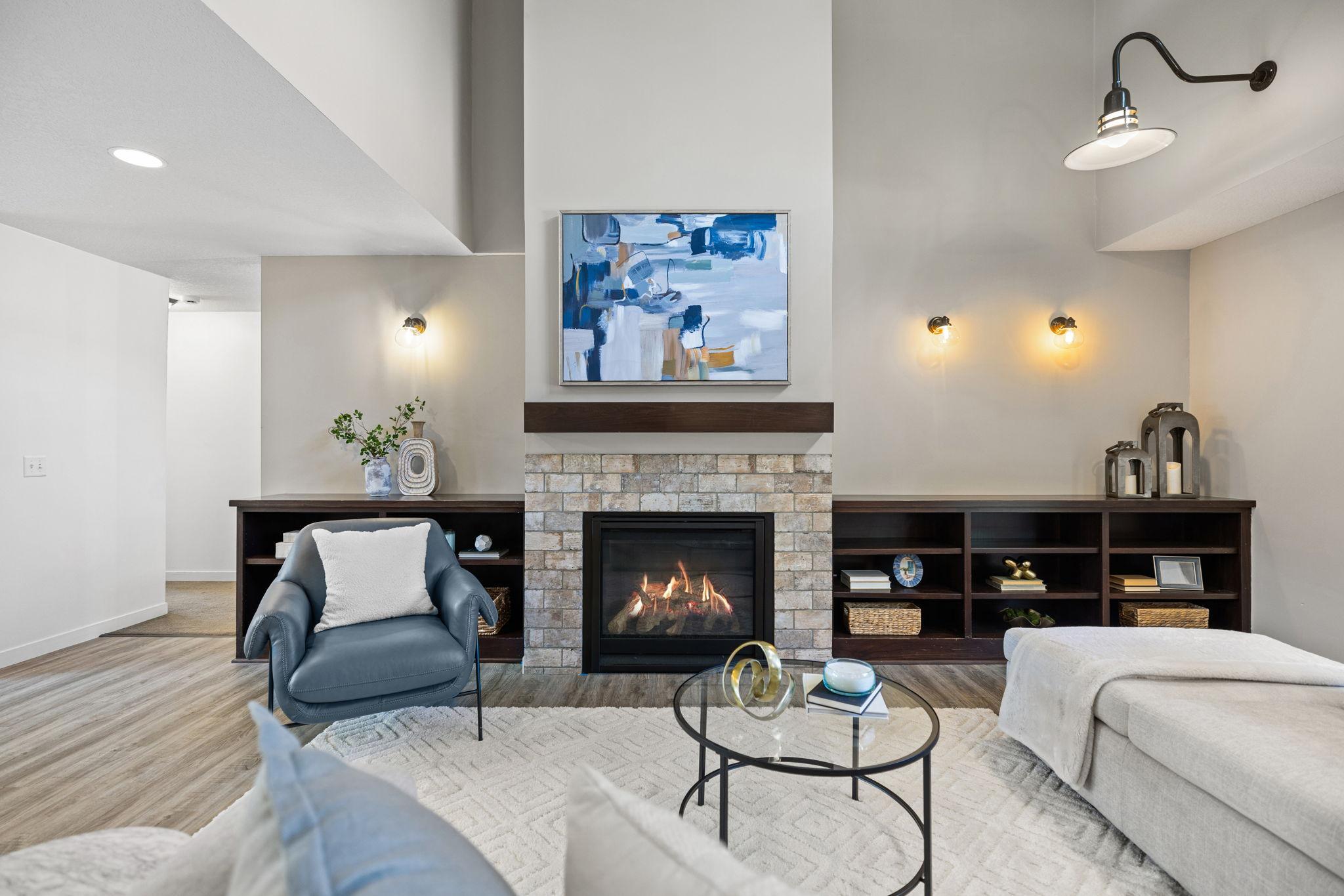 The inviting living room includes built-ins and a gas fireplace for added comfort during colder months.