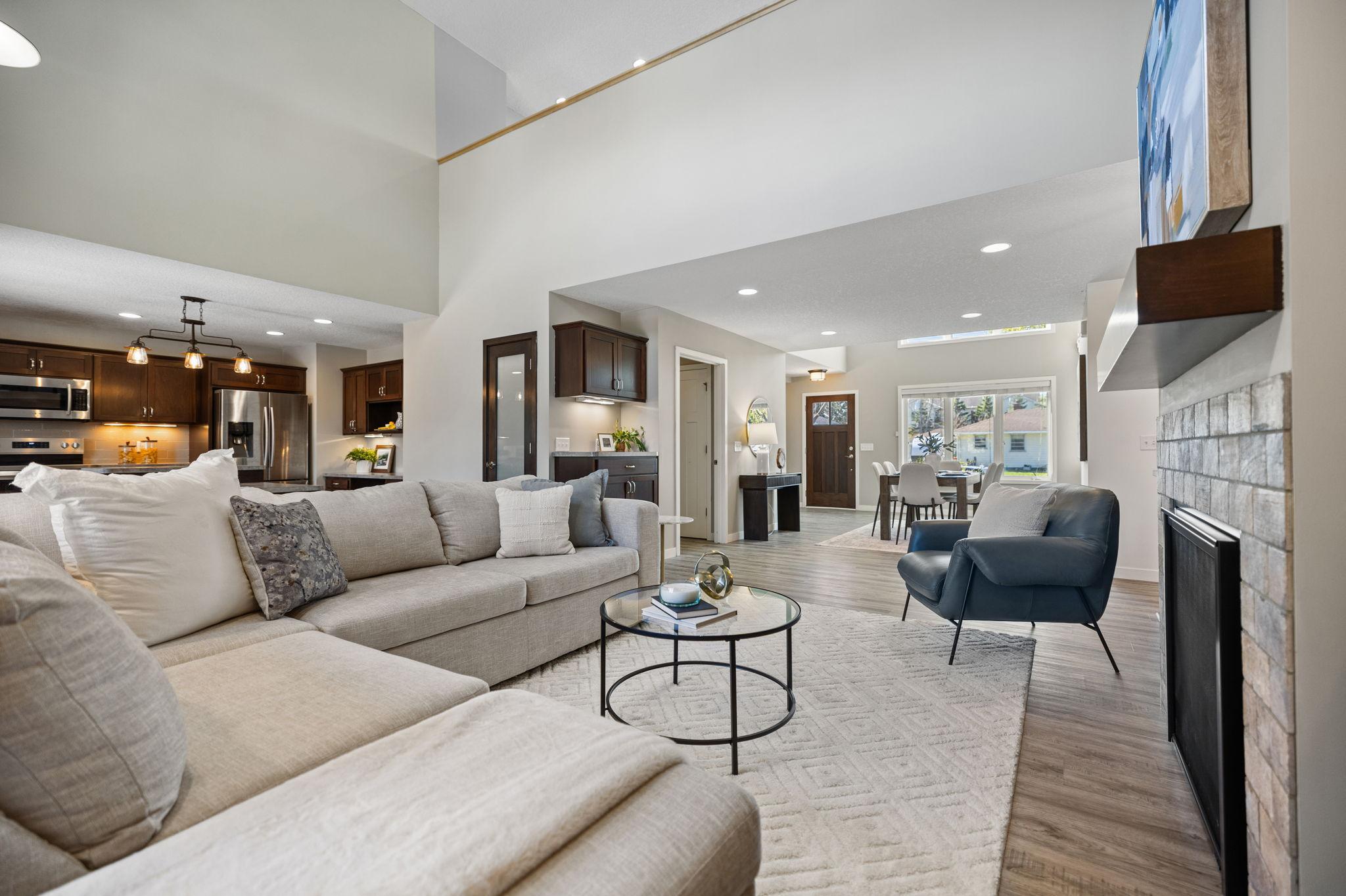 The main level features 18-ft ceilings and an abundance of large windows that fill the home with natural light.