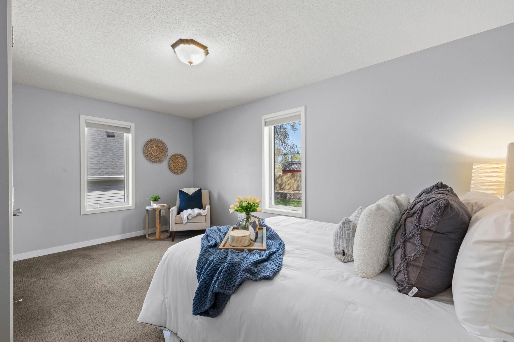 Three main-level bedrooms offer flexible living options.