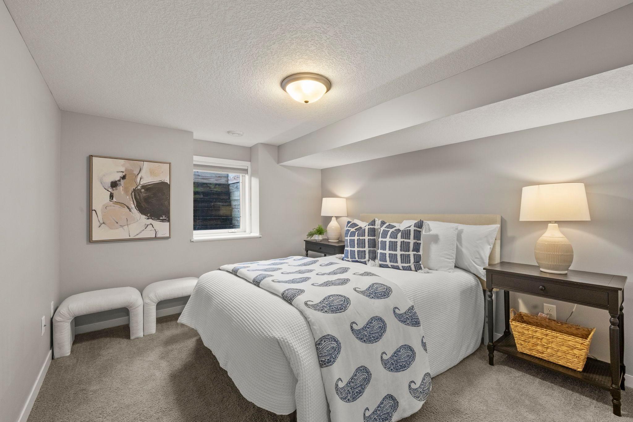 A fifth bedroom includes soft carpeting and a closet with wire shelving for easy organization.