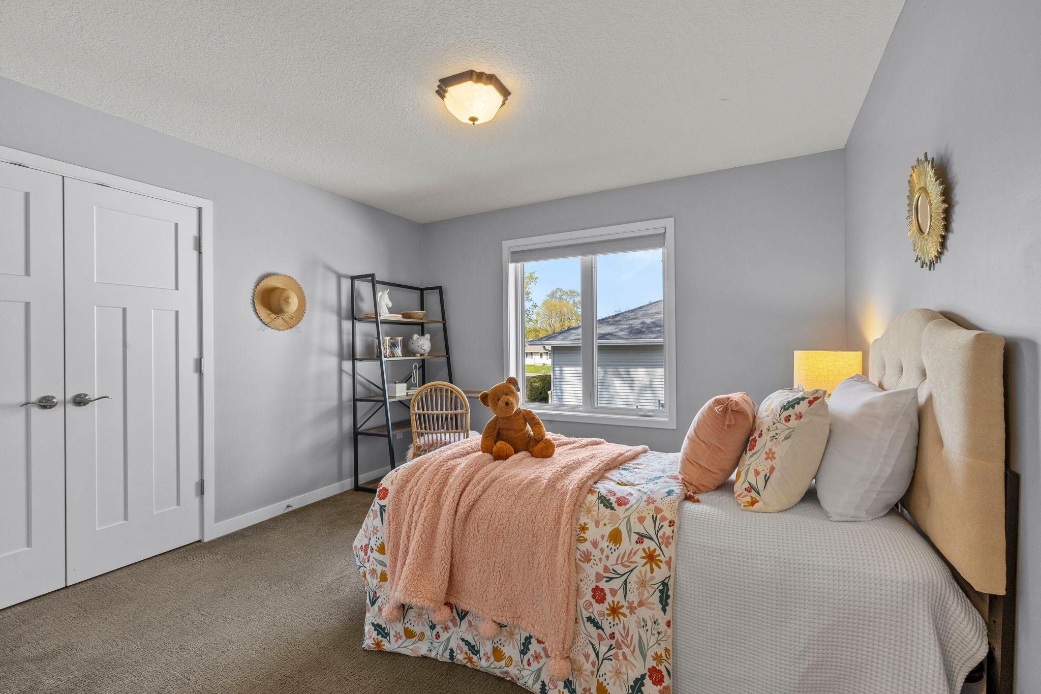 Each room includes comfortable carpeting, closet storage, and large windows for natural light.