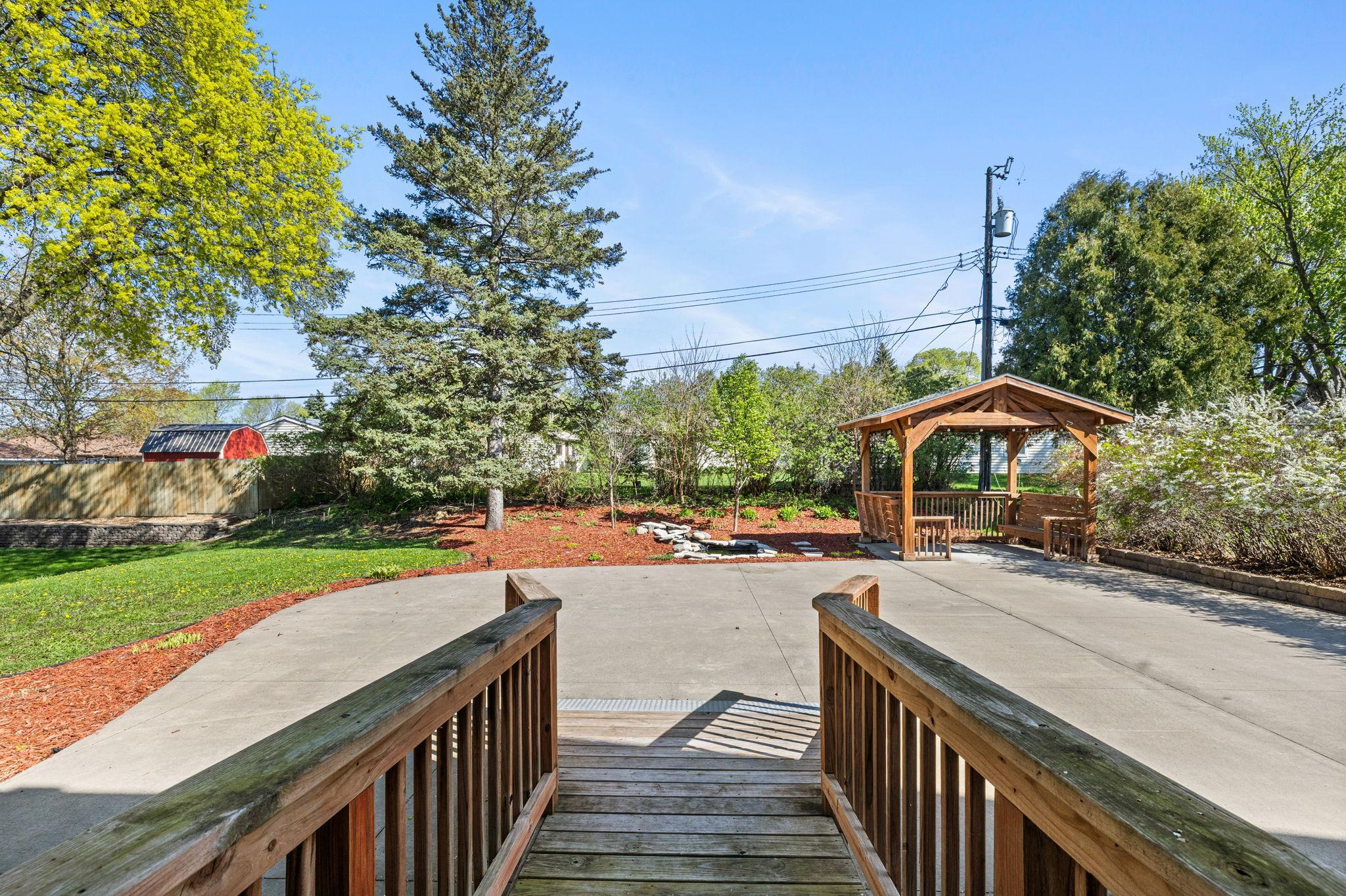 Walkout access leads directly to the backyard with a ramp for accessibility.