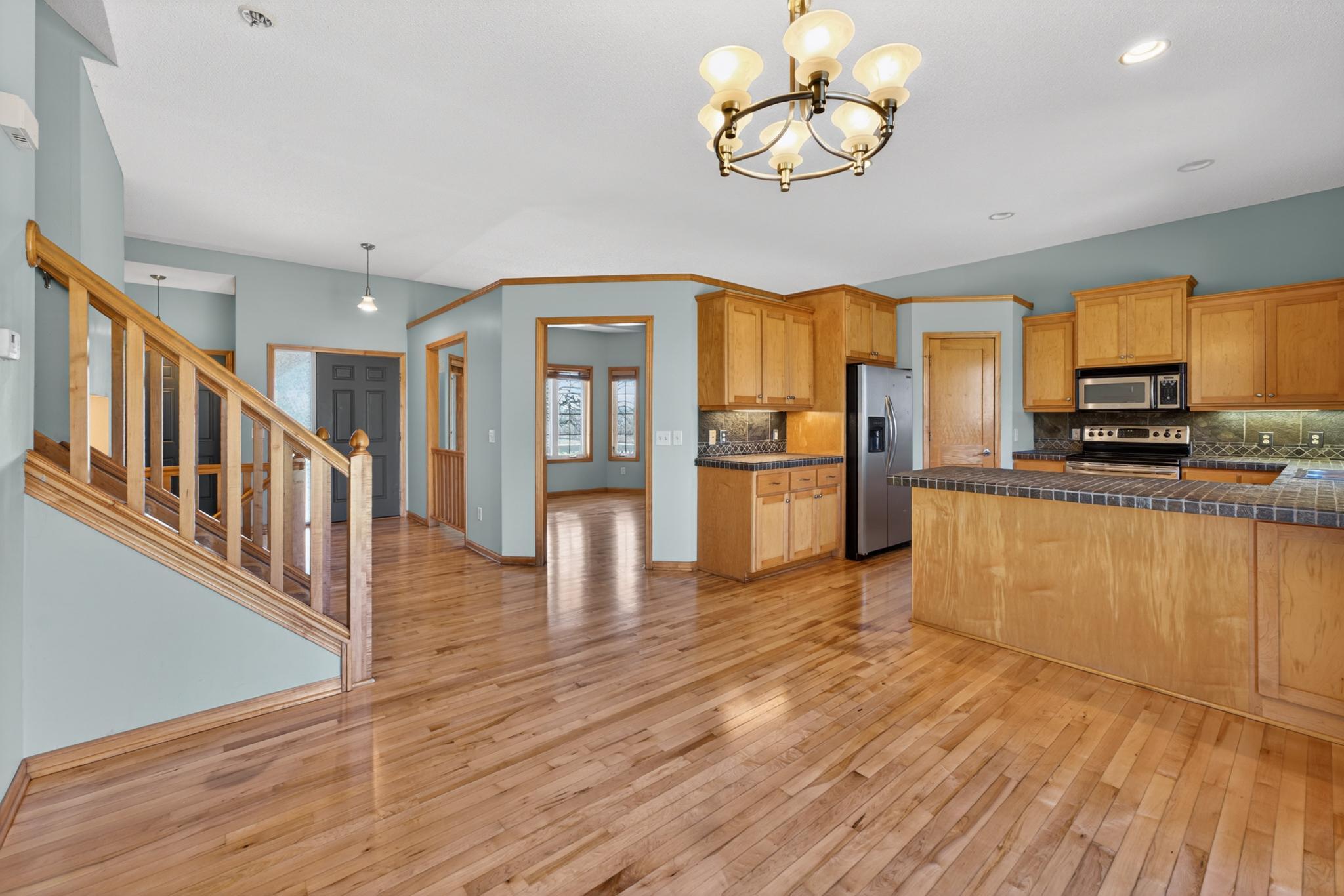 Spacious Main Floor features Maple Hardwood Floors