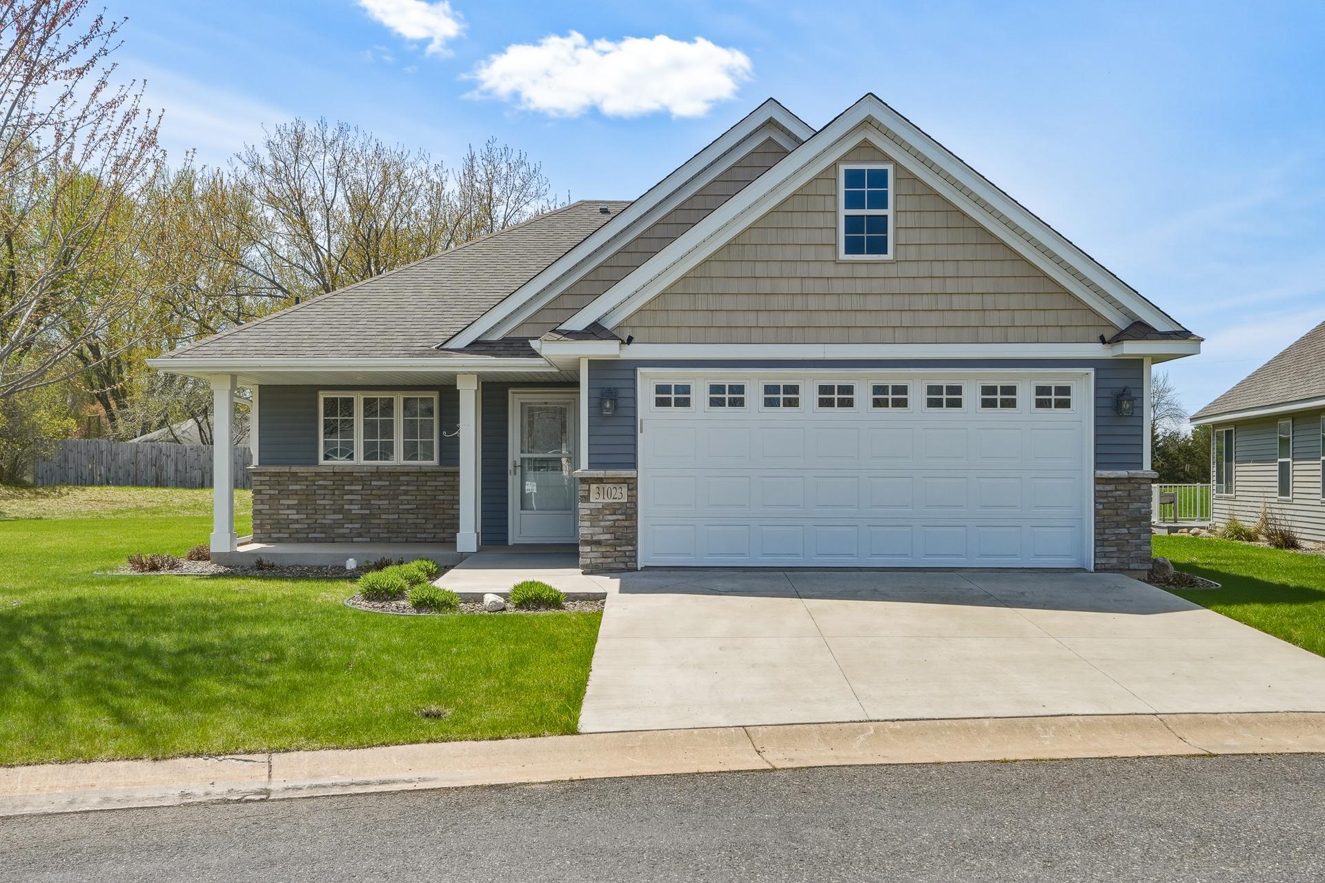 Stunning one-level detached townhome on beautiful level lot.