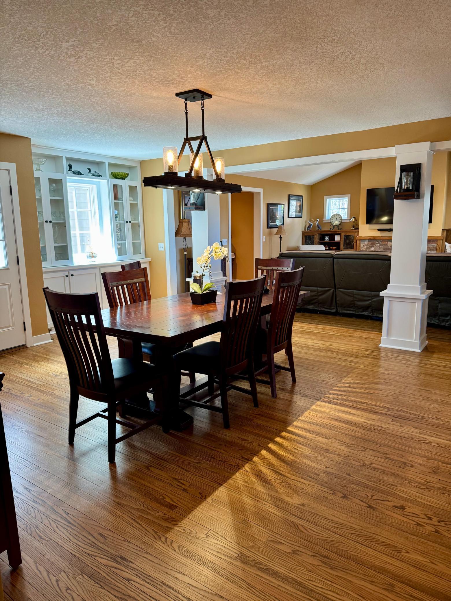 A Very Spacious Dining Area Overlooking The Living Area! Open, Airy, Spacious Makes This A Great Place To Gather!