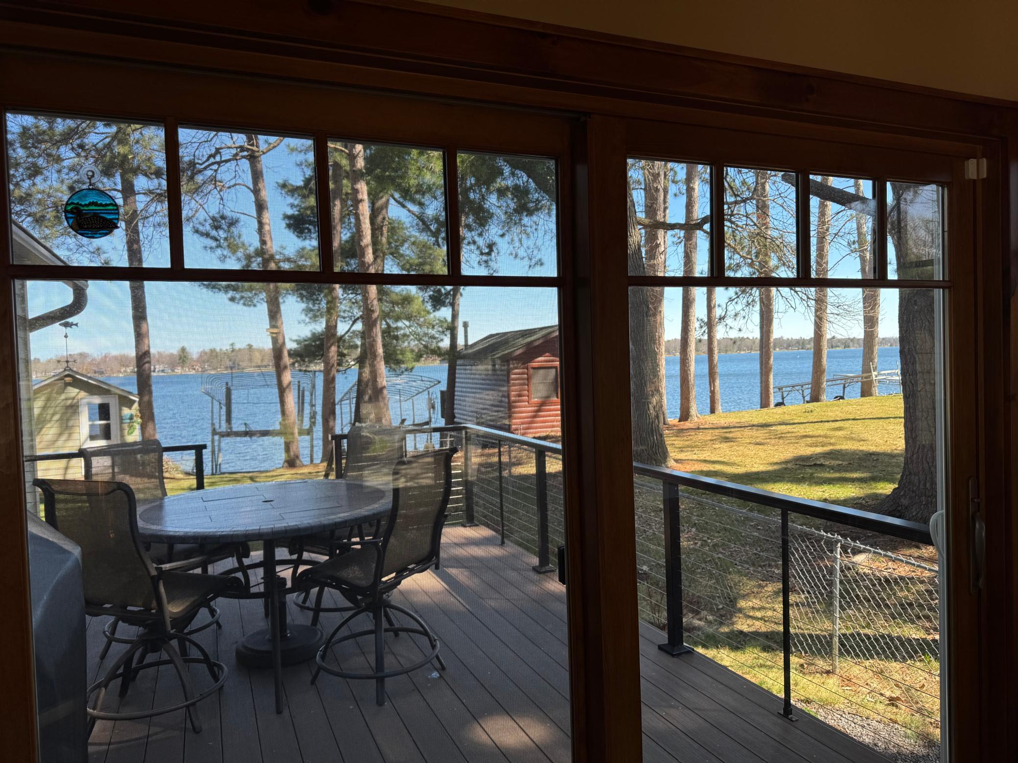 Enjoy The Amazing Views From The Four Season Porch/Sun Room Overlooking The Lake!