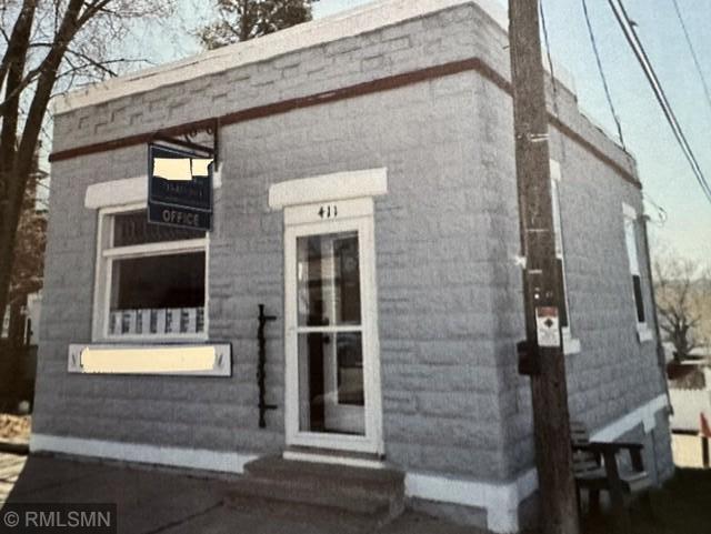 Front of building (brokerage name obscured). Street view