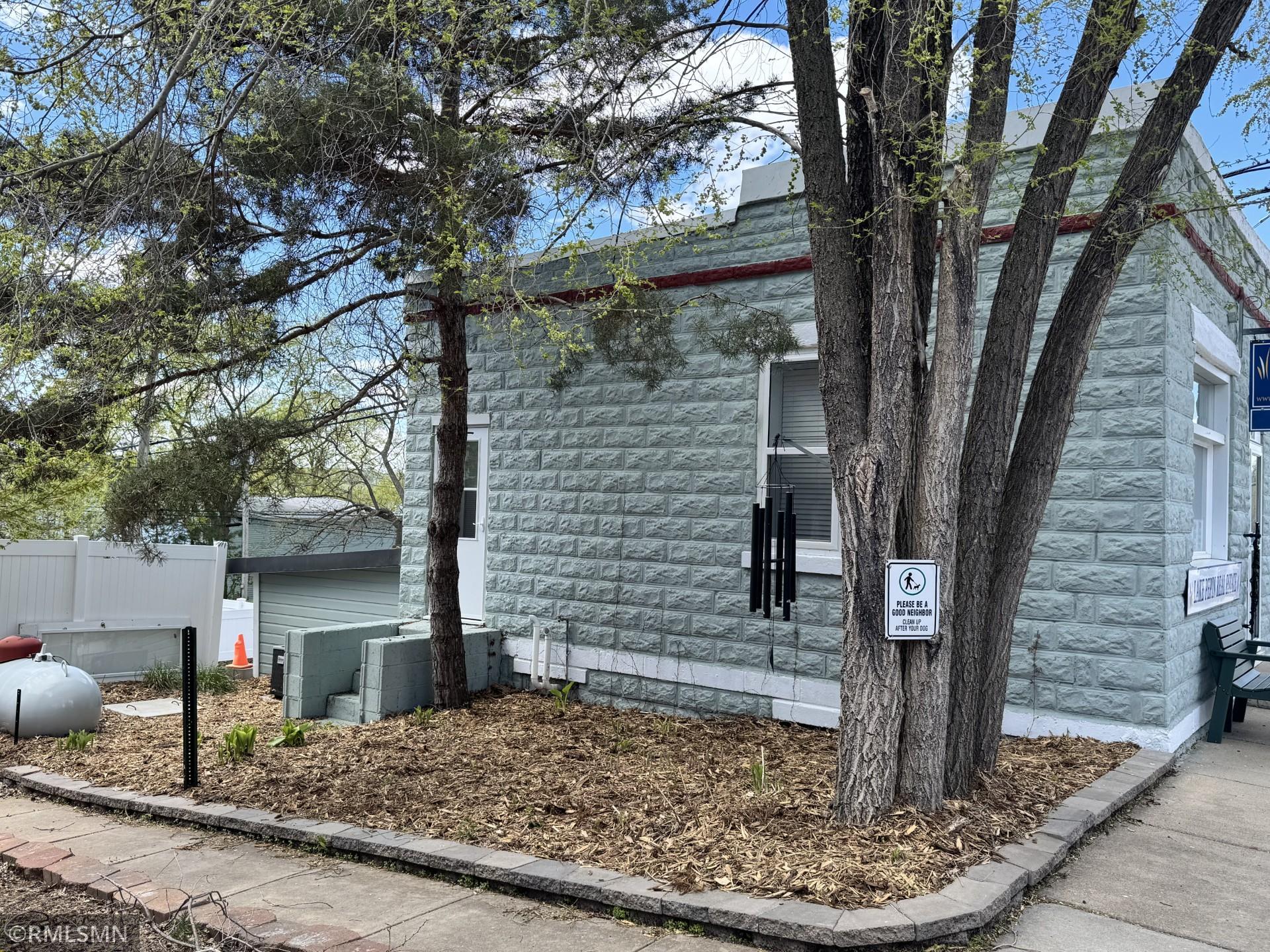 Left side of building, showing rear entry and hosta garden newly mulched