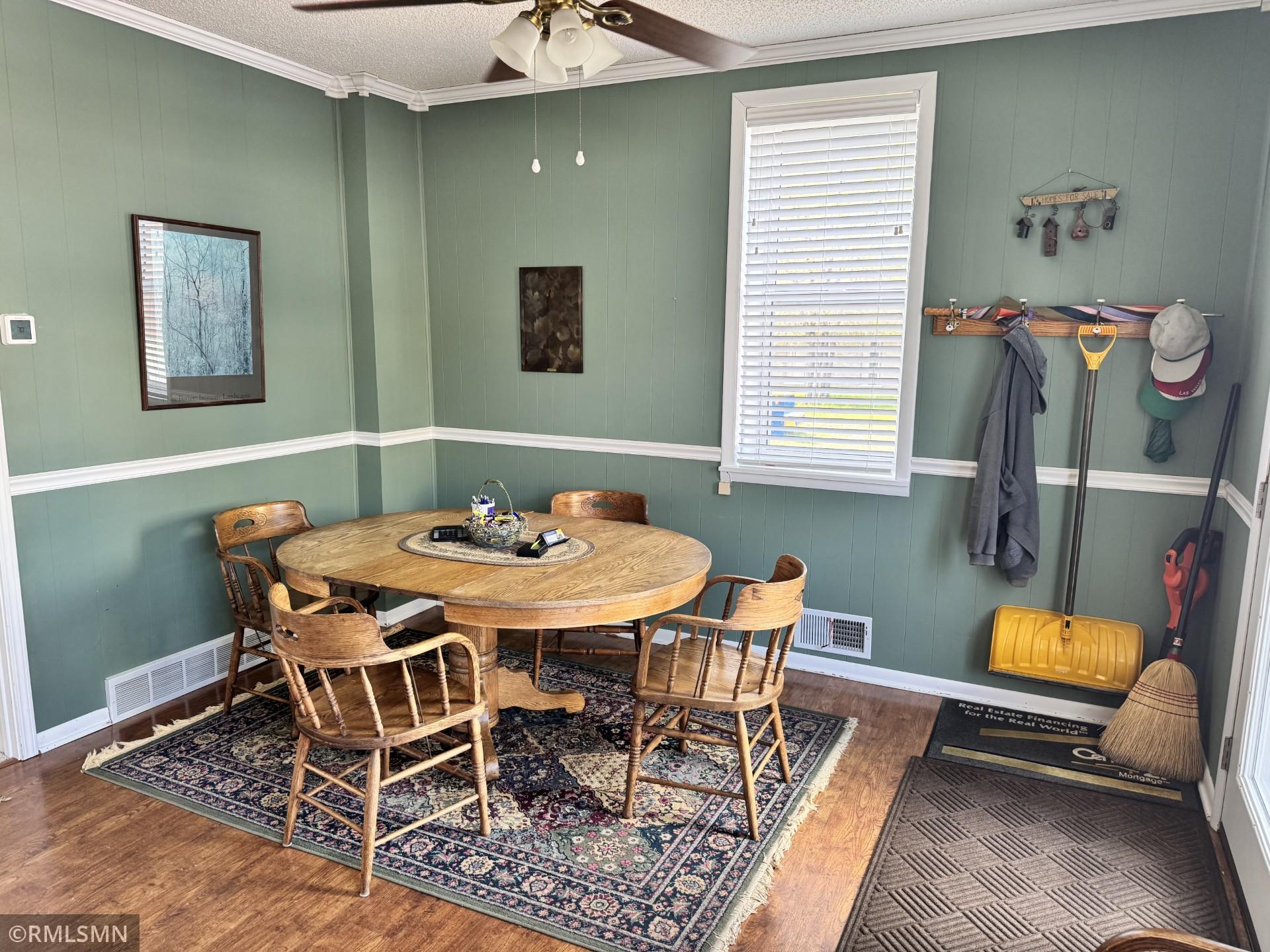 Interior showing antique conference table and chairs.