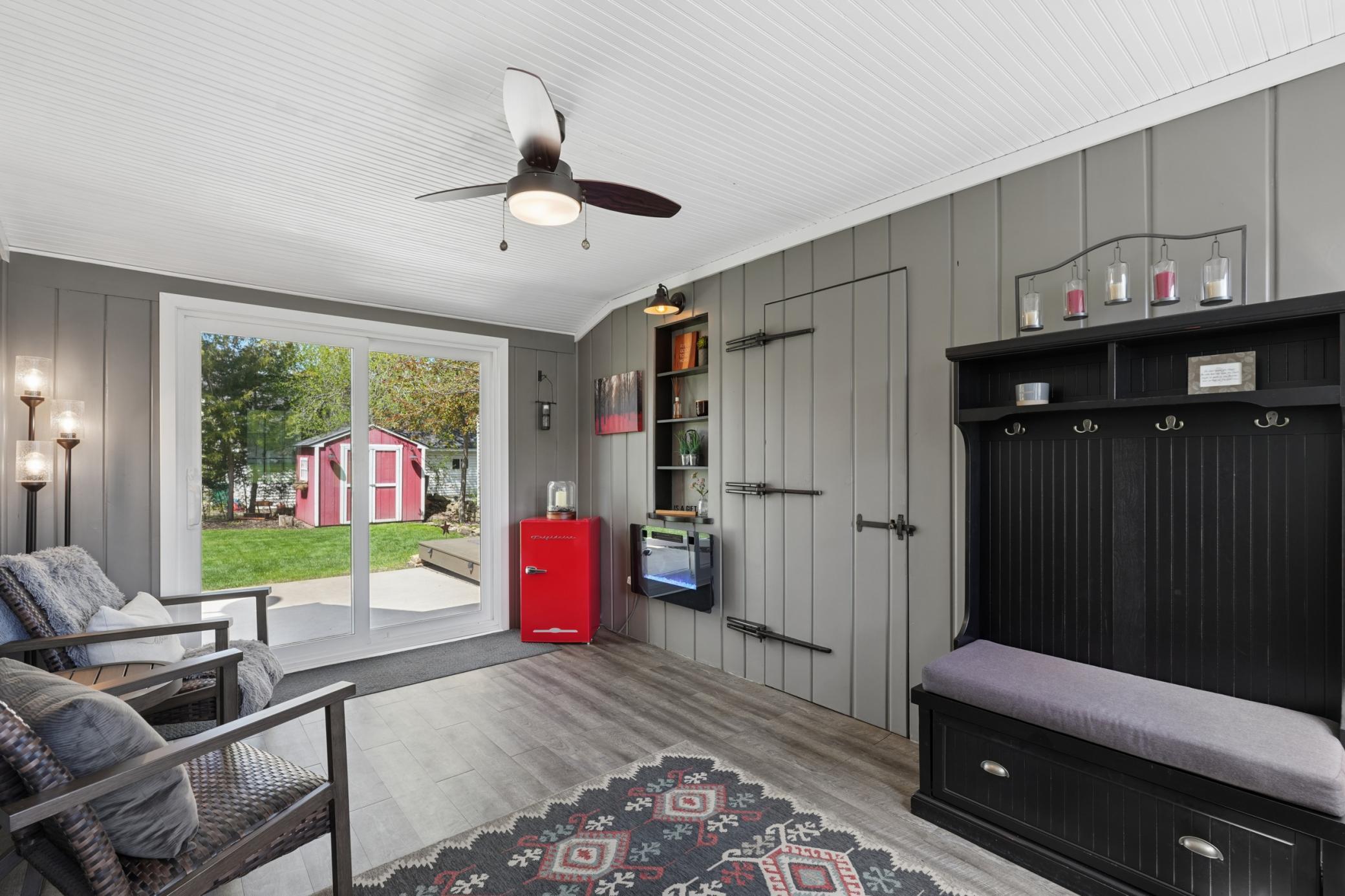 The breezeway features a new sliding glass door and an electric fireplace.