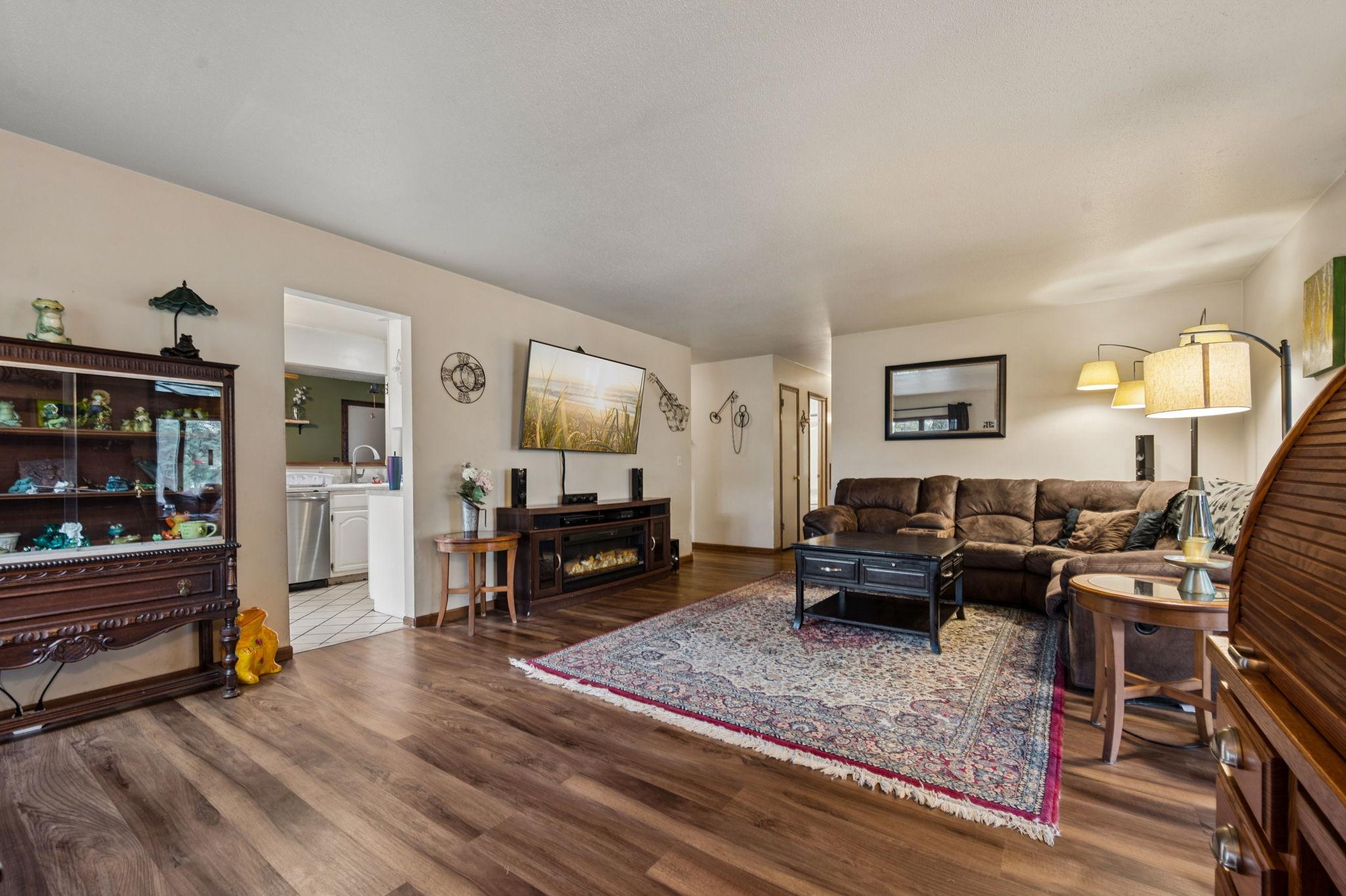 Living Room Has New Flooring Lots Of Natural Sunlight..