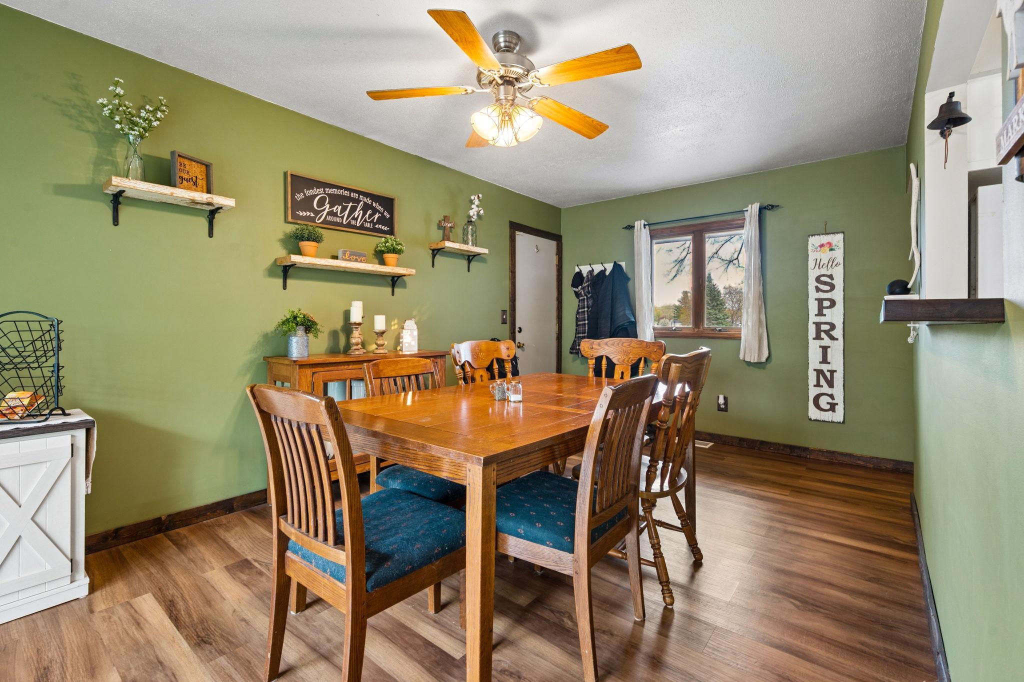 Dining Room Has A Cutout Area Open To Kitchen... Newer Wood Flooring With A Walkout To Side Patio & To Garage.. Perfect For Grilling & Entertaining