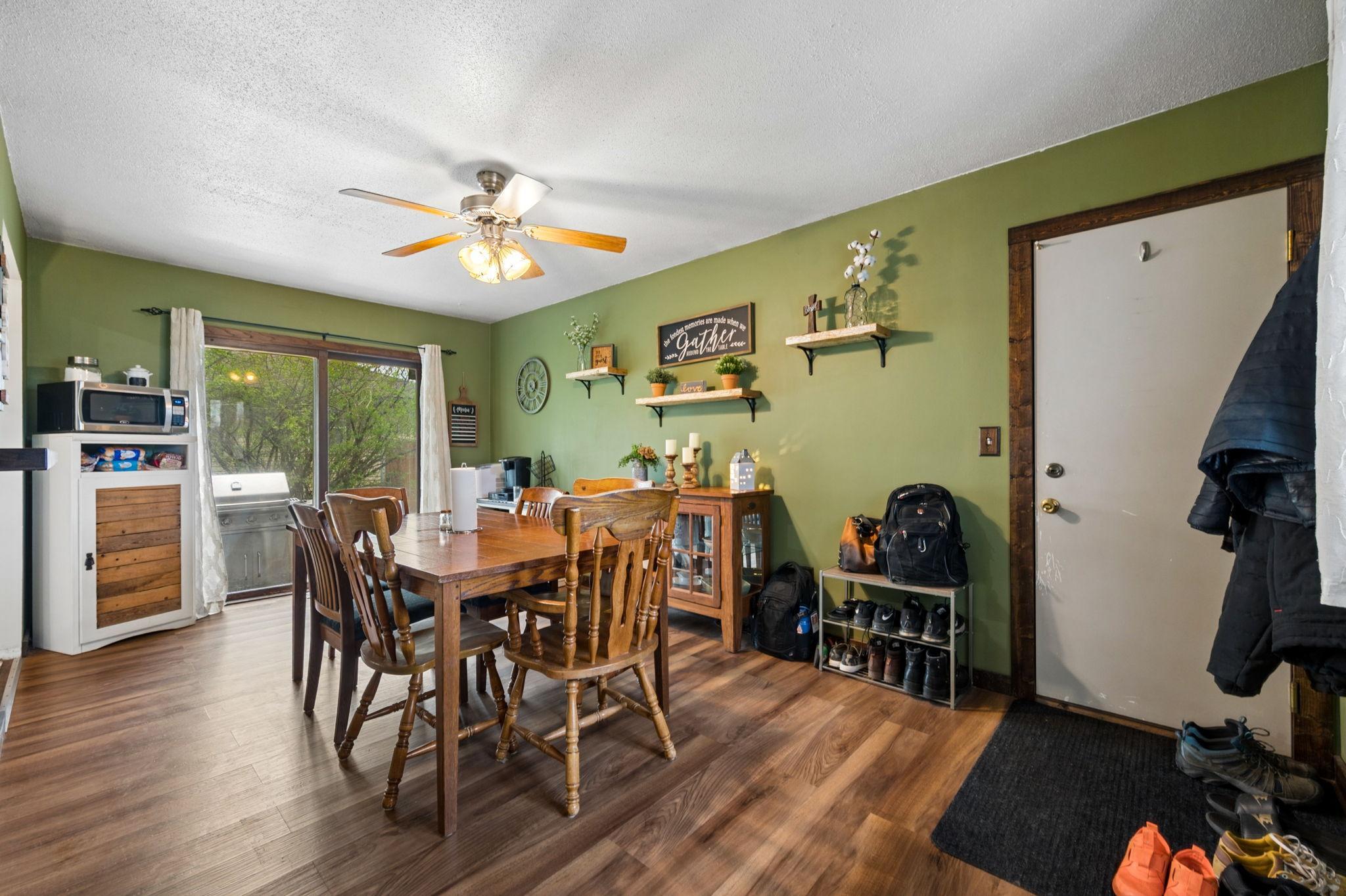 Dining Room Has Newer Wood Flooring With A Walkout To Side Patio & To Garage..