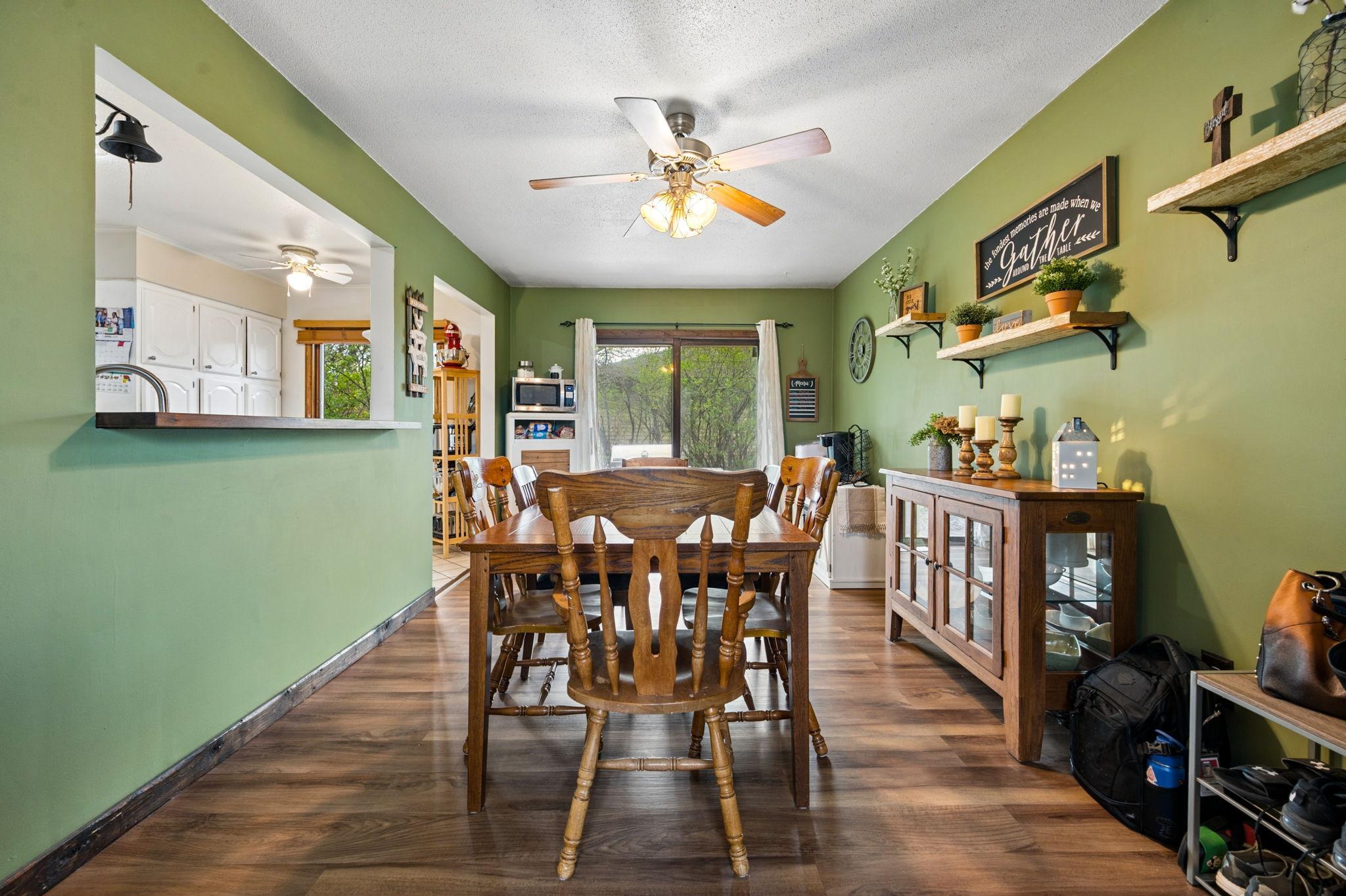 Dining Room Has A Cutout Area Open To Kitchen... Newer Wood Flooring With A Walkout To Side Patio & To Garage.. Perfect For Grilling & Entertaining