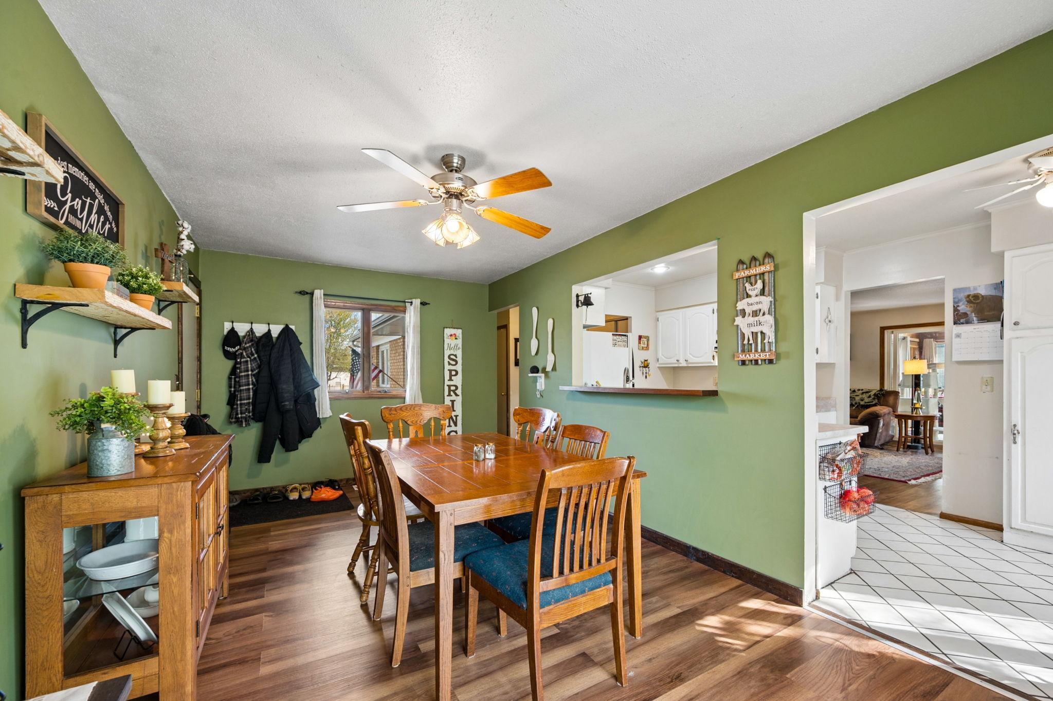 Dining Room Has A Cutout Area Open To Kitchen... Newer Wood Flooring With A Walkout To Side Patio & To Garage.. Perfect For Grilling & Entertaining