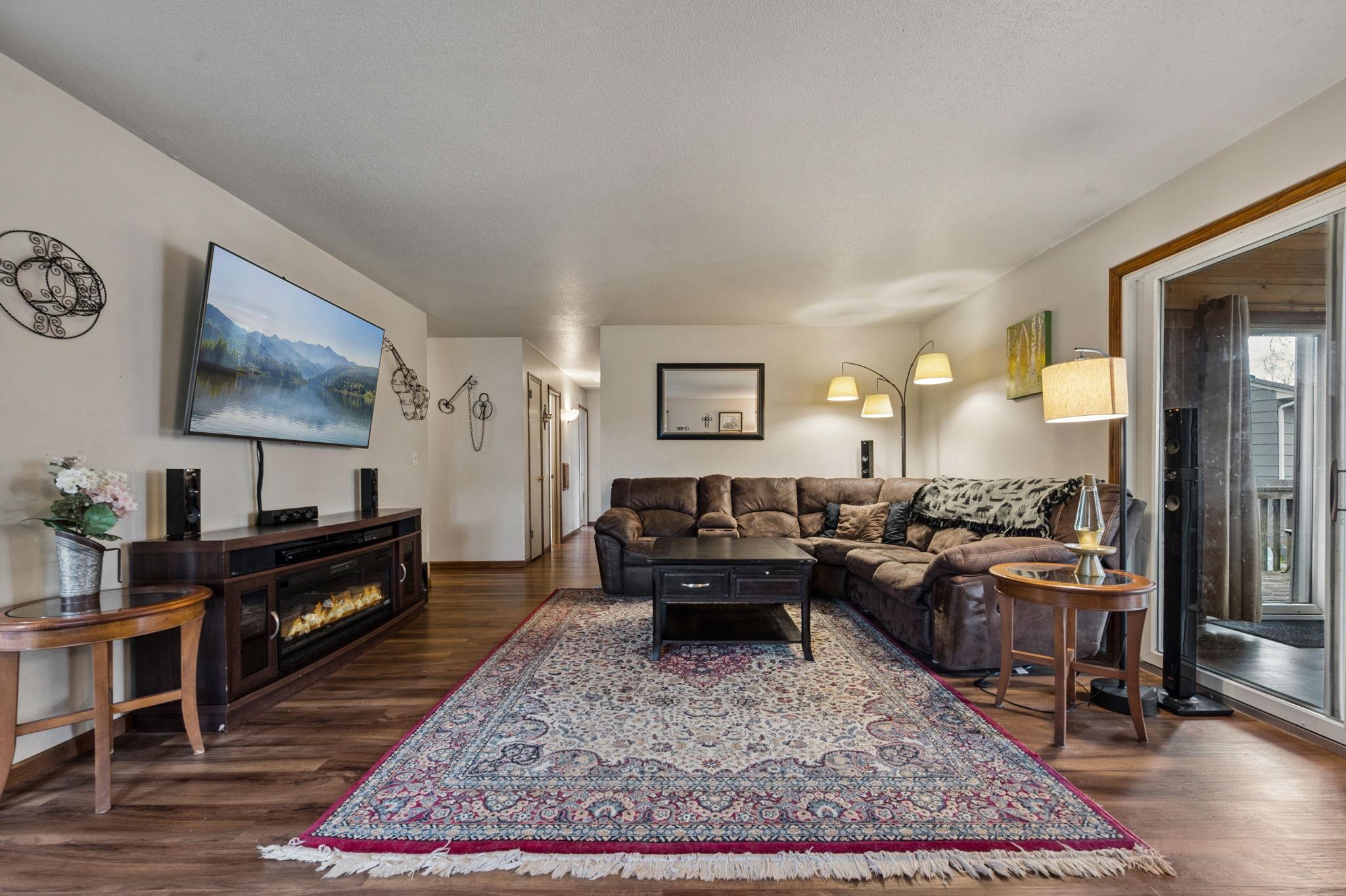 Living Room Has New Flooring Lots Of Natural Sunlight..